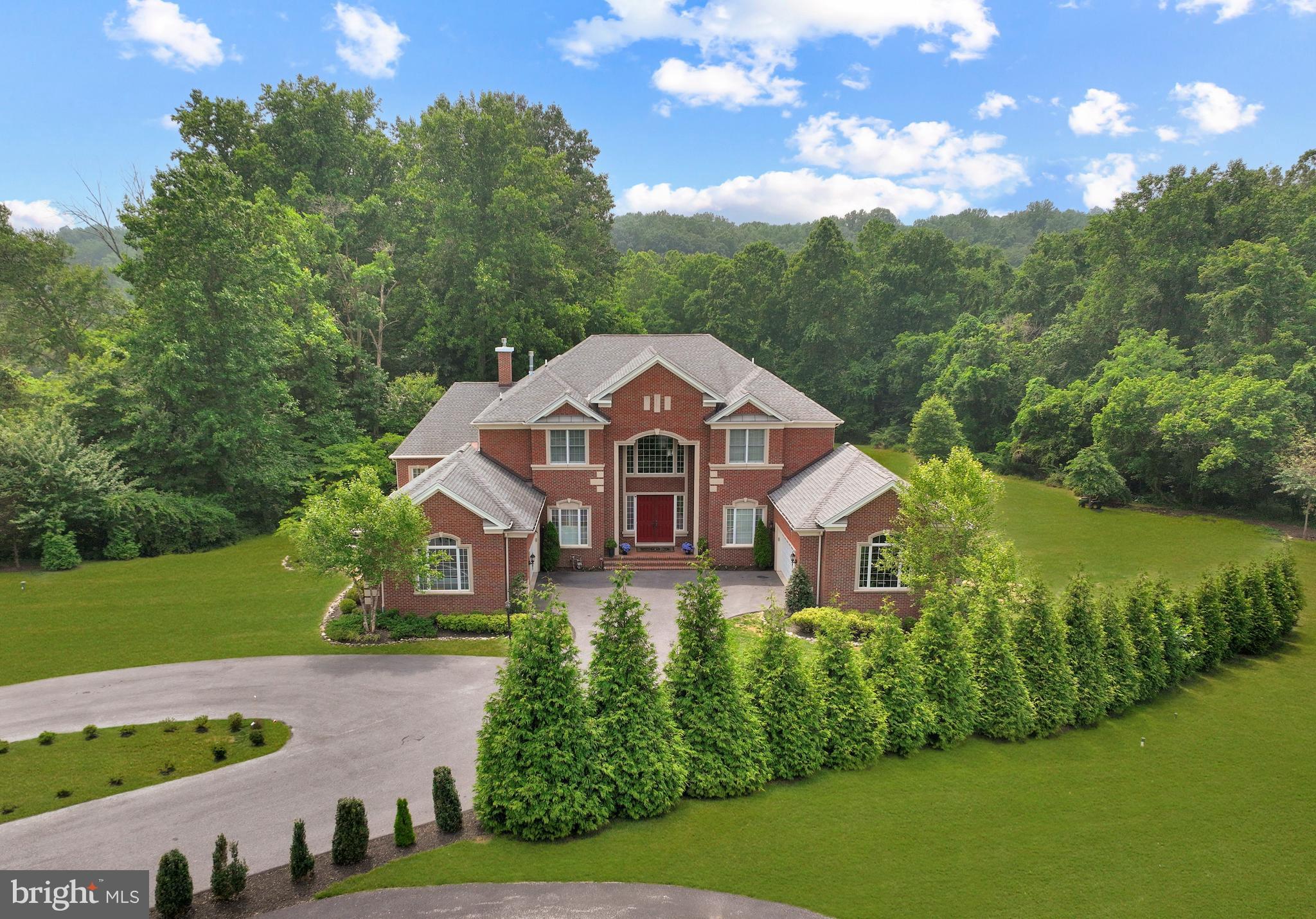Absolutely Incredible, Fully Upgraded, 10,500 Sq Ft+ Estate Home on an Incredibly Private Lot, Located Just Minutes to Grocery, Restaurants, Starbucks, 32, 29, 95 and Much More! As you enter this Gorgeous Home, you are Greeted at a Two-Story Foyer with Dual Curved Staircases and a Marble Floor. The Main Level features an Upgraded Chef's Kitchen with Large Island, Commercial Wolf 8-Burner Range and Wolf Hood, SubZero Refrigerator, Wall Oven and Microwave Combo, and a Spacious Island with Seating. The Main Level Continues to the Expansive Family Room and Grand Conservatory with Vaulted Ceilings and a Wall of Windows.  The Two-Story Dining Room Opens to the Light-Filled Sunroom and Formal Living Room with Custom Window Treatments. There is a Spacious Additional Full Owner's Suite on the Main Level, including On-Suite Bath and Walk-in Closet, as well as a Private Office with French Doors. Off the Breakfast Area, walk through the glass doors to the Flagstone Patio, Perfect for Continuing the Entertainment.

The Upper Level features the Owner's Suite with Fireplace, Sitting Room, Dual Walk-in Closets and Lux Owner's Bath with Dual Vanity, Soaking Tub, Separate Shower, and Water Closet. The Upper Level also includes Three Additional Generously-Sized Bedrooms, Each with Direct Access to an On-Suite Bath.

The Lower Level is the Entertainer's Galore. It features an Incredible Custom Bar that Surpasses 5-Star Hotels and Michelin Starred Restaurants, including an All-Glass Encased Wine Cellar. The Movie Theater includes Bartop Seating and Reclining Leather Chairs. The Lower Level continues to The Expansive Rec Room, Lower Level Living Room, Powder Room, and an Additional Lower Level Owner's Suite with On-Suite Bath and Walk-in Closet. 

Walk out from the Lower Level to the Flagstone Patio and Utmost Privacy in your Rear Yard. Follow the Path from the Rear Yard to a Beach on a Tranquil Creek (See Photos). This Smart Home Features 5-Zone HVAC with Ecobee Thermostats, Tesla Charger, and LED Light Fixtures Throughout.  Open House Saturday 7/15, 1-3PM.