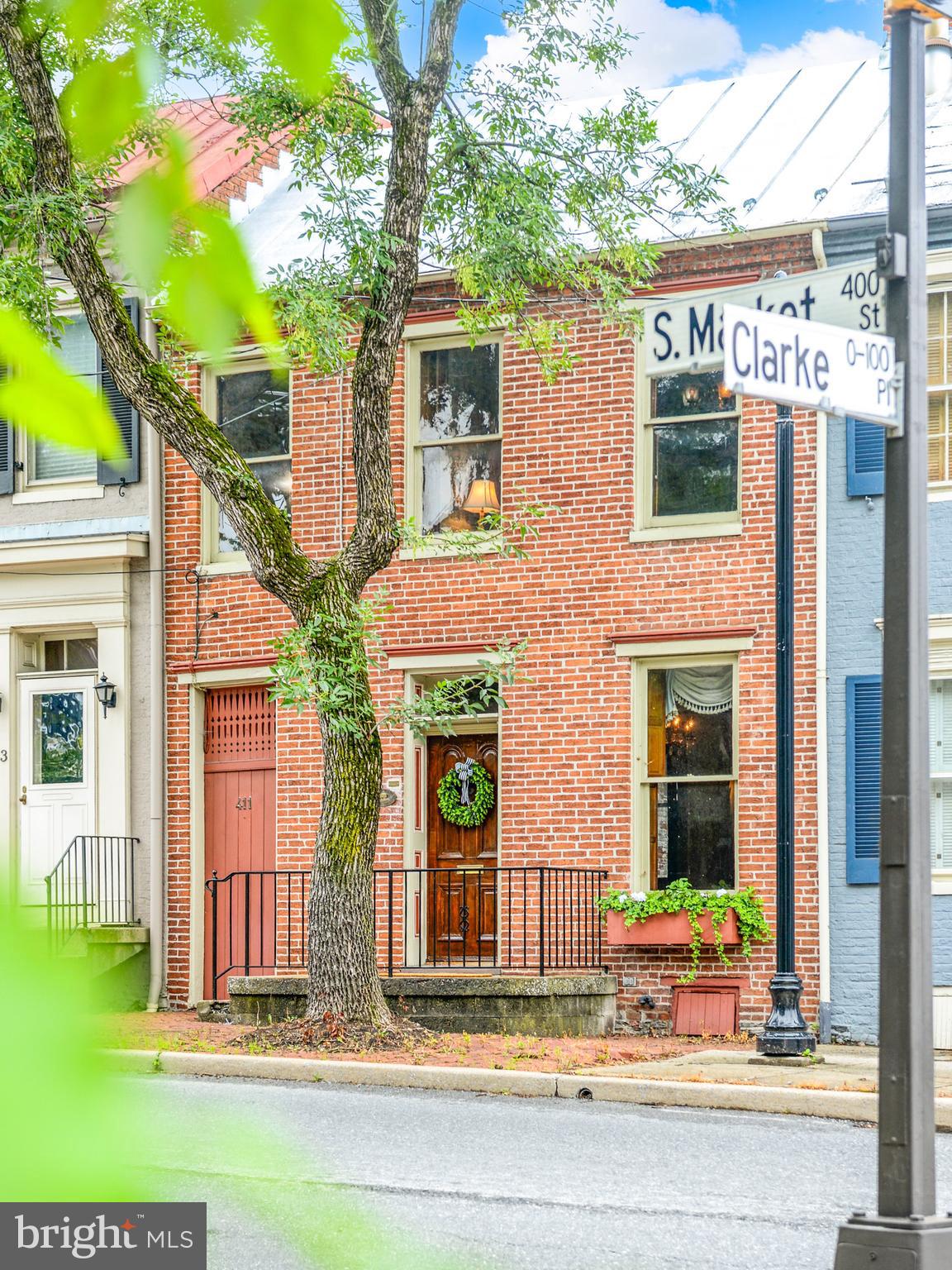 Exceptional brick townhome in downtown Frederick with delightful and private fenced garden and off-street parking.  Situated in the Historic District and registered as No. 241 by Frederick County Landmarks Foundation, this significant home features 3 bedrooms, 1½ baths, and a main level laundry.  Hardwood floors and tall ceilings add to the captivating ambiance and character.  A walk-up attic offers room for storage or expansion.  Just steps from Carroll Creek Linear Park, the MARC Commuter Train, great shops, restaurants, nightlife, and everything downtown Frederick has to offer.  Three generations have lived in and lovingly cared for this well-maintained beauty.  This graceful gem awaits the vision of its next steward.