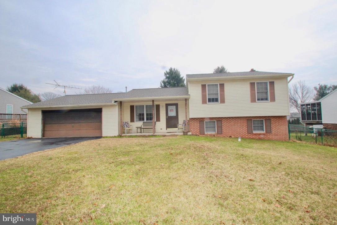 Great split level in Country Community yet close to town with large level & fenced yard. 5 yr young roof & replacement windows. Hardwood floors, living room & dining room. Maintenance free deck for  enjoying your yard. Lovely oak kitchen w-newer stainless appliances. Over sized 2 car garage.  Seller will give a $3,500 credit at settlement for cosmetic upgrades if buyers choice.