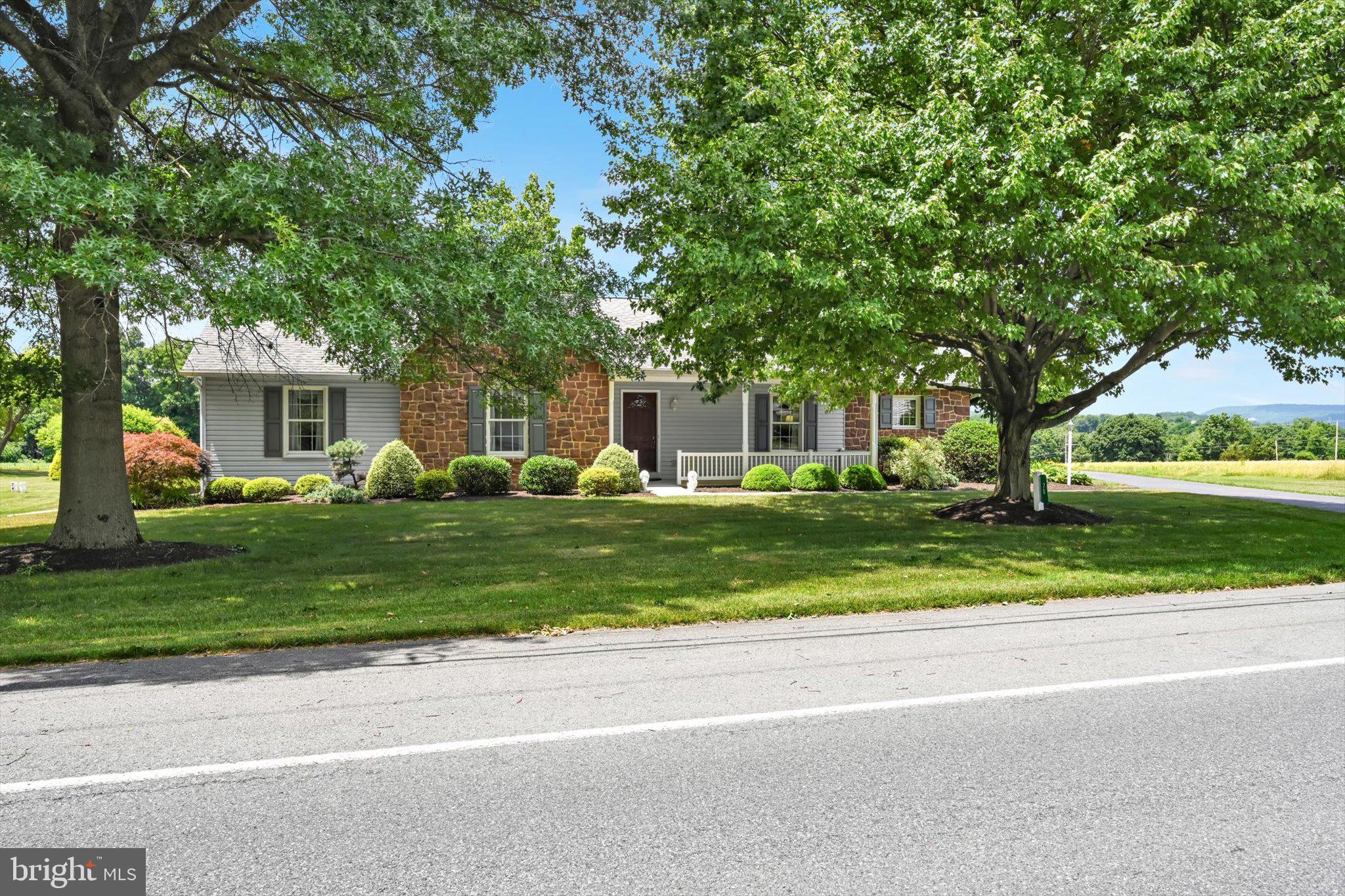 Enjoy the ease of one-floor living in this spacious 2,200 square foot home situated on a picturesque half-acre lot overlooking peaceful farmland.  Designed for both comfort and functionality, this home features 3 bedrooms, 2-1/2 bathrooms, and an inviting layout.
The heart of the home is the large kitchen, complete with abundant cabinetry, pantry, convenient lazy Susans, and plenty of workspace for cooking and entertaining.  The adjoining greatroom offers a warm and welcoming atmosphere with custom built-in cabinets and ample space for gathering with family and friends.  Retreat to the bedrooms, including a primary suite with a private bath, and walk in closet.  Additional features include a half bath for guests and main level laundry room.
Step outside to relax on the charming side porch, where you can take in the beautiful countryside views and enjoy the tranquility of the surrounding farmland.  A 3 car garage provides plenty of room for vehicles, storage, and hobbies.
This exceptional property combines modern convenience, generous living space, and a peaceful rural setting-offering the perfect place to call home.