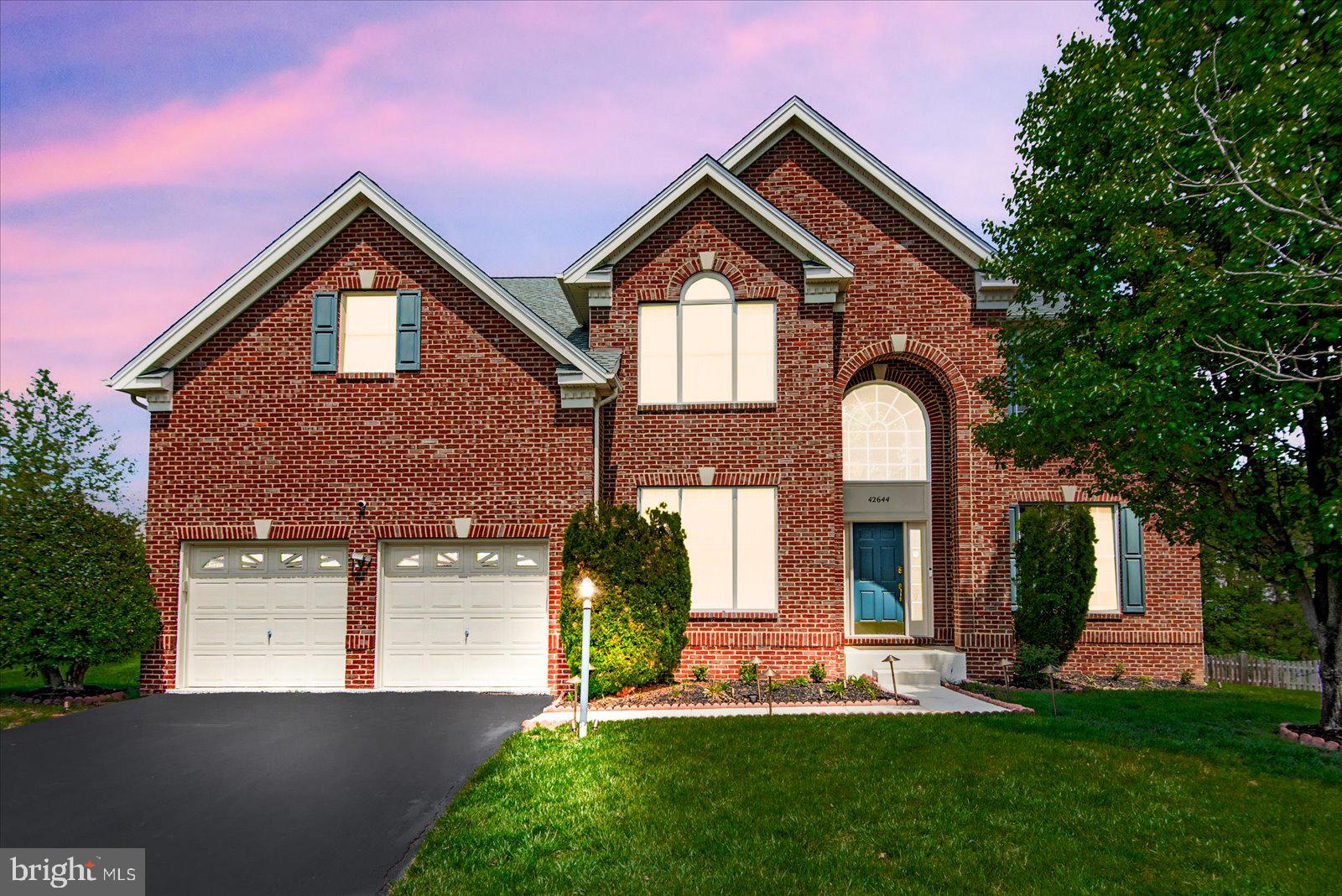Stunning one-owner Toll Brothers colonial in highly desirable South Riding! 5,000+ sq ft of beautifully finished living space across 3 levels. Gleaming hardwood floors flow throughout the main level, showcasing an open floor plan with soaring vaulted ceilings in the family room. Sunroom off rear leads to Trex deck overlooking a flat, fully usable backyard — perfect for entertaining. Upper level features LVP flooring, spacious primary suite with sitting area and custom walk-in closet. Walk-up basement is an entertainer's dream with fully finished wet bar and wine cooler. Major updates incl. roof ( 7 yrs), new water heater & professionally epoxy-coated garage floor. South Riding offers resort-style amenities incl. 4 pools, tennis courts, walking trails & top-rated Loudoun County schools. Minutes to Dulles Airport, One Loudoun, Rt. 50, Rt. 28 & Dulles Toll Road. Don't miss this move-in ready gem!
