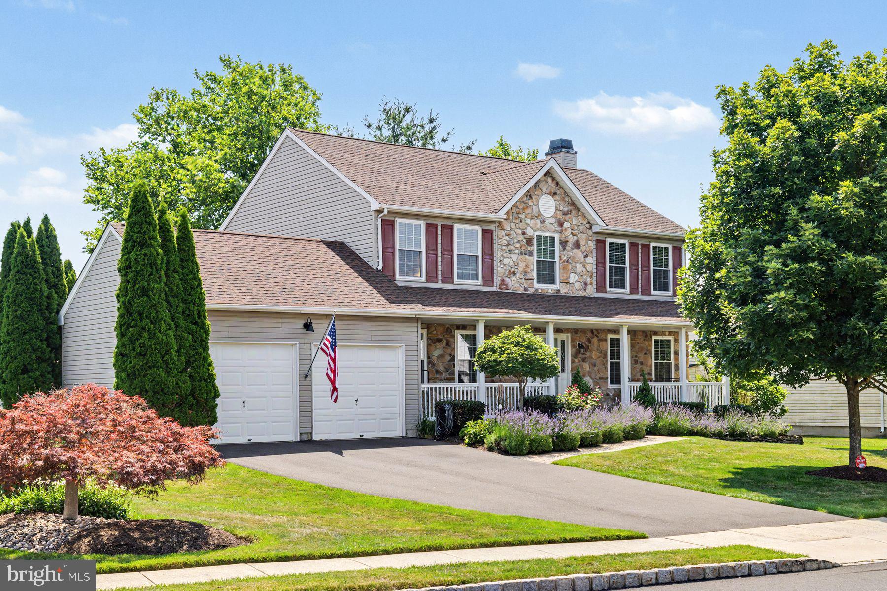 Perfectly positioned on a premier lot in the highly sought-after Maple Knoll community, this beautifully updated farmhouse-style Colonial offers timeless charm with classic millwork & moldings throughout, private office space with French glass pane doors ,exceptional outdoor living, and a picturesque setting backing to protected open space.
A stately stone façade and inviting full-length covered front porch welcome you inside, where a classic center hall layout is enhanced by glorious Brazilian cherry flooring and tasteful upgrades throughout. The thoughtfully renovated interior features beautifully remodeled kitchen and baths, hardwood flooring, and meticulous attention to detail, creating a move-in-ready home with enduring style.  All 4 bedrooms are equally enhanced and outfittedwith their own California closets .
At the heart of the home, the bright center-island kitchen showcases white craftsman cabinetry, a charming gardenview window above the sink, and a sunny breakfast area with sliding doors leading outdoors. The adjacent family room is equally inviting, anchored by a dramatic floor-to-ceiling stone fireplace. & baywindow framing peaceful backyard views.
Designed for both entertaining and everyday living, the finished lower level offers impressive ceiling height, a full wet bar complete with wine & mini fridges, recessed lighting, custom built-in shelving, a dedicated hobby or flex space, and abundant storage. Additional storage can also be found in the floored attic, accessible from both the garage and fourth bedroom.
Outside, professionally landscaped grounds surround the home with vibrant gardens, an expansive paver patio, relaxing spa, and terraced retaining walls that create an exceptional outdoor retreat. Backing to mature trees and protected open space, the setting provides beauty, privacy, and a tranquil backdrop throughout the seasons.   This exceptional home is just minutes from parks, shopping, dining, walking distance to top-rated schools, and everyday conveniences, offering the perfect balance of peaceful surroundings and easy accessibility.
EV charger in garage. Tankless water heater.  Backup water powered sump pump.  
Invisible Dog Fence.   New Roof in 2020.