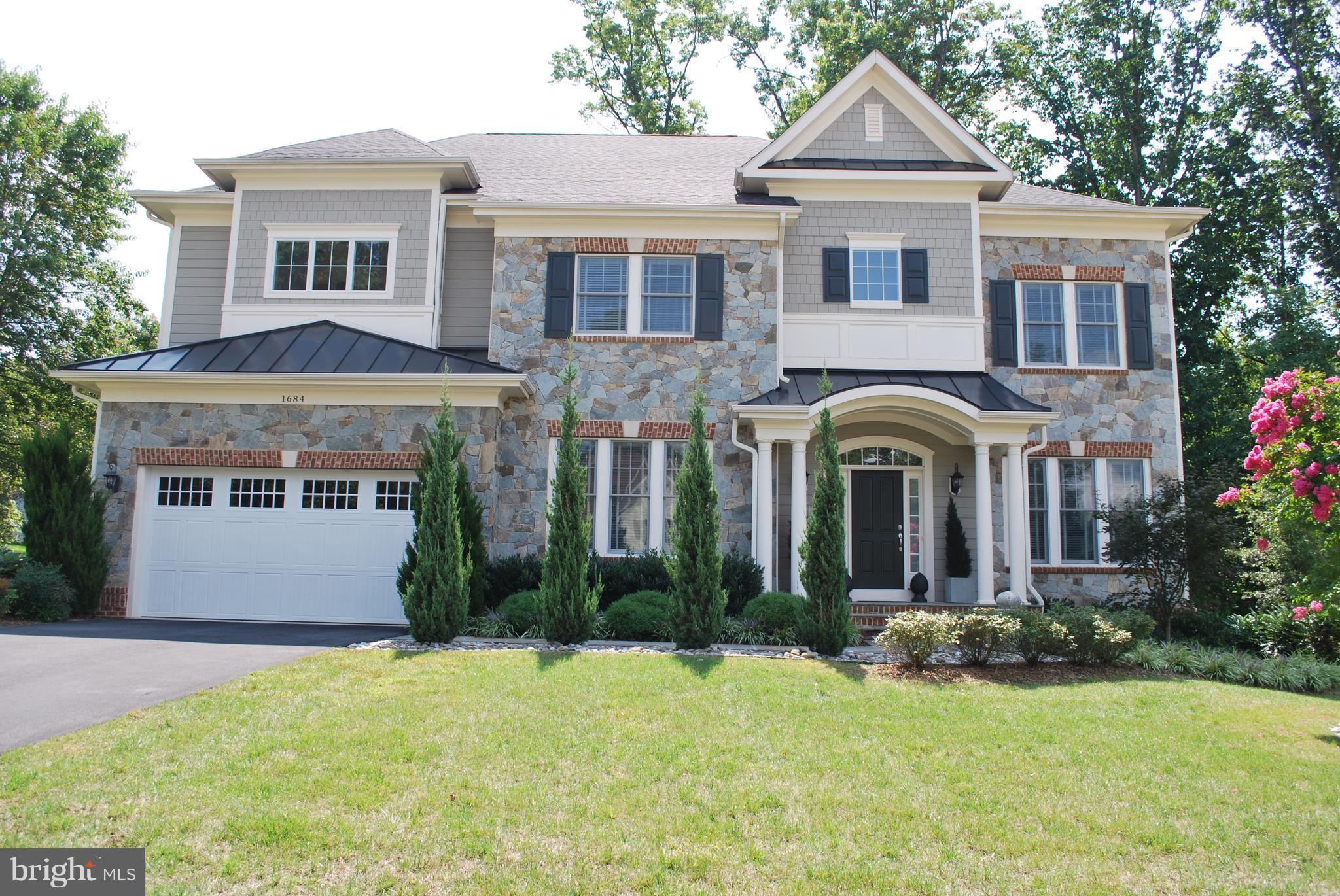 Almost new home in quiet cul-de-sac.   $150,000 in upgrades.  Hdwd floors on main level.  Chef's gourmet kitchen with granite,  6 burner stove, wall oven center island.  FR with stone FP.  Lg. Owner's suite w/ sitting rm. & en suite.  2nd BR w/ en suite.  3 & 4th BR with Full Bath.  Finished bsmnt  with bym,  steam shower & sauna.  Composite deck. custom landscape yd. w/ irrigation and lighting.