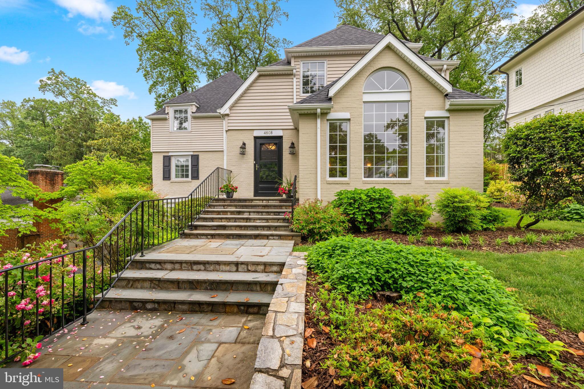Located in sought after Country Club Hills, this home has been thoughtfully updated and expanded, featuring a new roof, hardwood floors, original details and upgrades throughout. With extensive flagstone hardscaping and stone steps leading to the front entrance, the main level offers a large living room with a Palladian window and built-ins, an elegant dining room with a wood-burning fireplace and board and batten detail, a gourmet kitchen with a Wolf cooktop and SubZero refrigerator/freezer and large pantry opening to a breakfast room and family room, a main level bedroom/office with a full bath and a powder room. Upstairs, there is  primary bedroom suite and two additional bedrooms sharing a renovated Jack and Jill bath. The lower level offers a recreation room, half bath and utility room with access to the attached one-car garage. With a private and treed setting, outdoor spaces include a deck off of the breakfast room and a bluestone patio. Only a short walk to Glebe Road Park with tennis, pickleball and basketball courts, as well as Jamestown Elementary School.