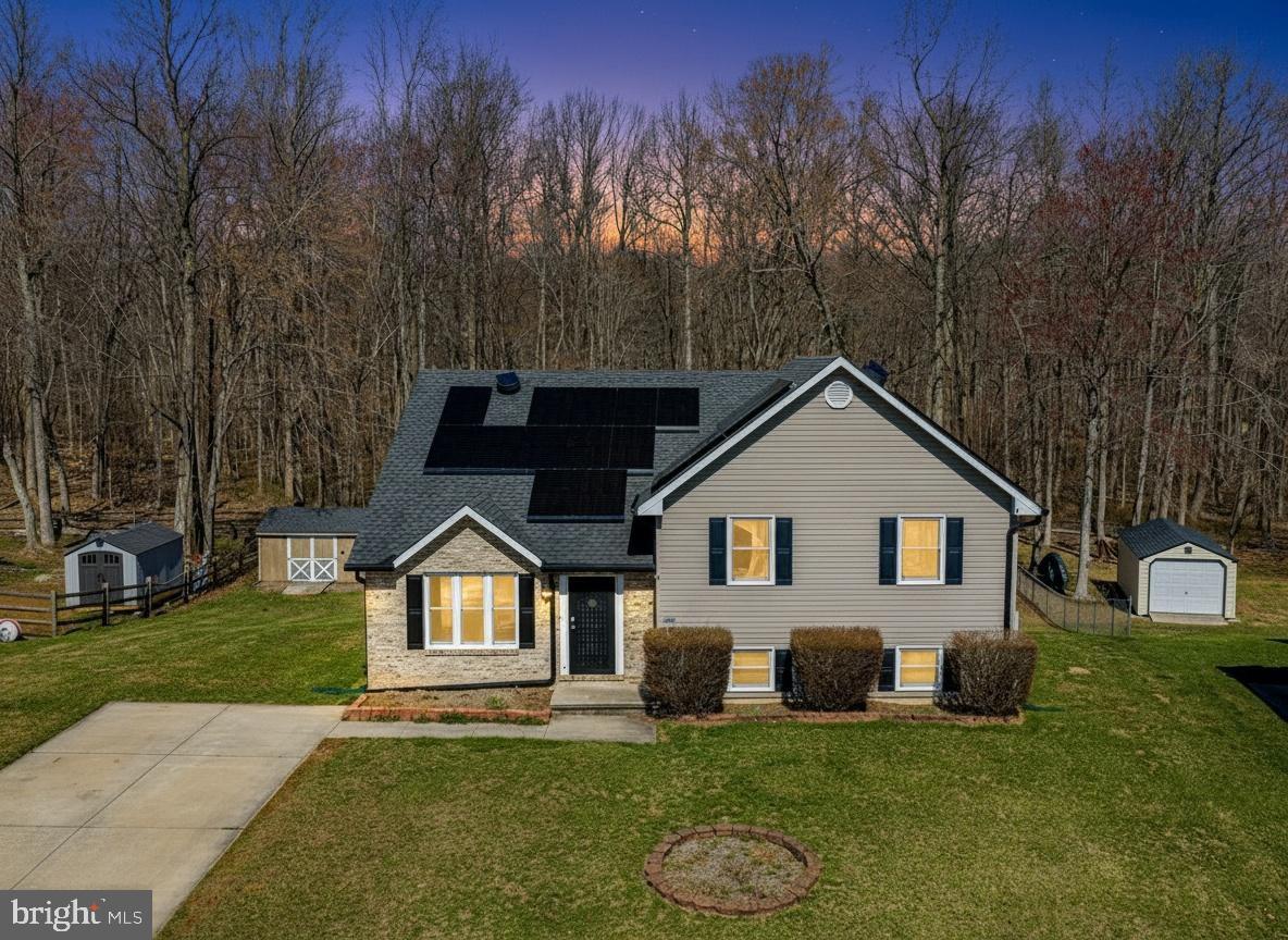 Beautiful split level foyer home on 2.8 Acres in Maxa Woods. Over 2000 sqft home offers large Family and Living room with 2 extra rooms on lower level. Full deck overlooking wide open rear yard. Yard includes large shed .  Full Home Solar system installed. Home with brand new windows, newer HVAC, hot water heater. Reduced electrcity use on energy bill.