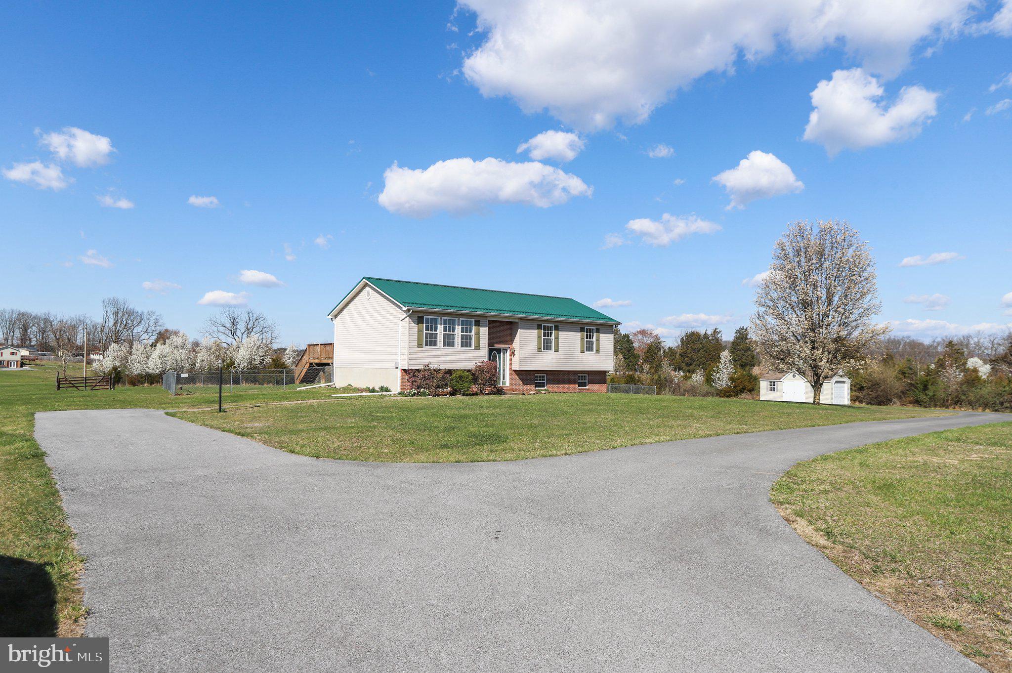 HIGHEST AND BEST OFFERS DUE SUNDAY 3/24 AT 12Pm
Unrestricted 1.47 Acre lot with Split level home featuring 3 bedrooms 2.5 baths and a finished lower level that can be a 4th bedroom or family / recreation room, leading to the laundry room, 1/2 bath, 2 car garage and larger storage areas.  The Primary bedroom has dual closet space, full bathroom with a jetted tub to soak in. 
This home has a metal roof, has been freshly painted and is ready for its new owner(s).  Your certain to find some peace and relaxation here as you spend time on the deck either preparing to get your day started or unwinding for the evening.  This property is spacious enough to host a back yard barbeque or till your own garden. Well water with extra water hydrant in the rear yard and public sewer