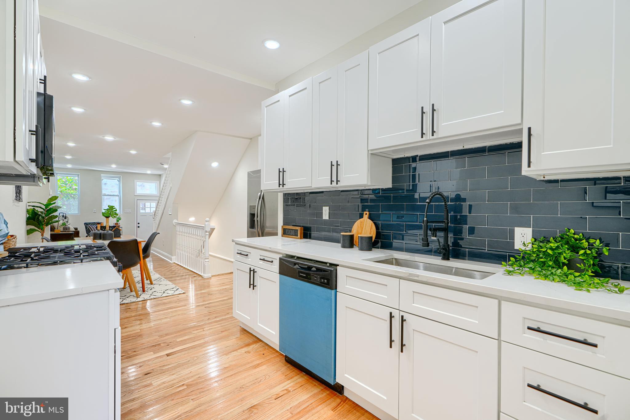 **Eligible for the vacant to value grant as well as the live near your work grant, among others! Ask me for more info, both houses on either side of the property are currently in the process of being completely renovated**Welcome to 1827 Druid Hill Ave, a beautifully updated end-of-group townhome featuring 4 bedrooms and 3.5 bathrooms, blending modern comfort with timeless elegance. Upon entry, you’re welcomed by a spacious living room with beautiful flooring that flows seamlessly throughout the main level. The gourmet kitchen is a chef’s dream, boasting stainless steel appliances, sleek quartz countertops, a crisp backsplash, and tall cabinetry for ample storage. Just off the kitchen, a door leads to a fully fenced yard and a spacious concrete patio, perfect for outdoor entertaining. The second level offers two generously sized bedrooms and a luxurious full bathroom, while the top floor is dedicated to a private primary suite featuring a spa-inspired bathroom with a showstopper shower equipped with multiple shower heads, modern glass doors, and elegant tile work. The fully finished basement includes an additional bedroom and a full bathroom, making it ideal for guests or multi-generational living. Situated on a block undergoing several renovations and revitalizations, this home qualifies for numerous grants to make homeownership more affordable—ask me for details. Don’t miss this incredible opportunity—schedule your tour today and take the first step toward owning this stunning home.