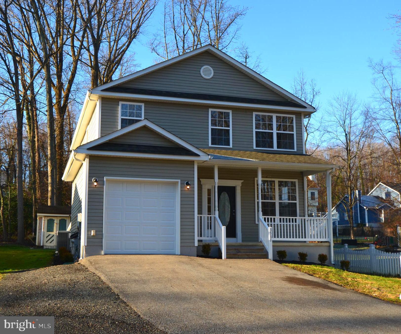 Move in condition. Freshly painted, new carpet, new sliding glass door. Spacious kitchen overlooking living/dining room with hardwood floors, gas fireplace, slider to rear patio. upper level offers large primary bedroom with cathedral ceilings, walk in closet, primary bath with soaking tub, shower and double vanity. 3 additional bedrooms and another full bath complete the upstairs. The rear yard offers shed. Additional lots behind the shed conveys.