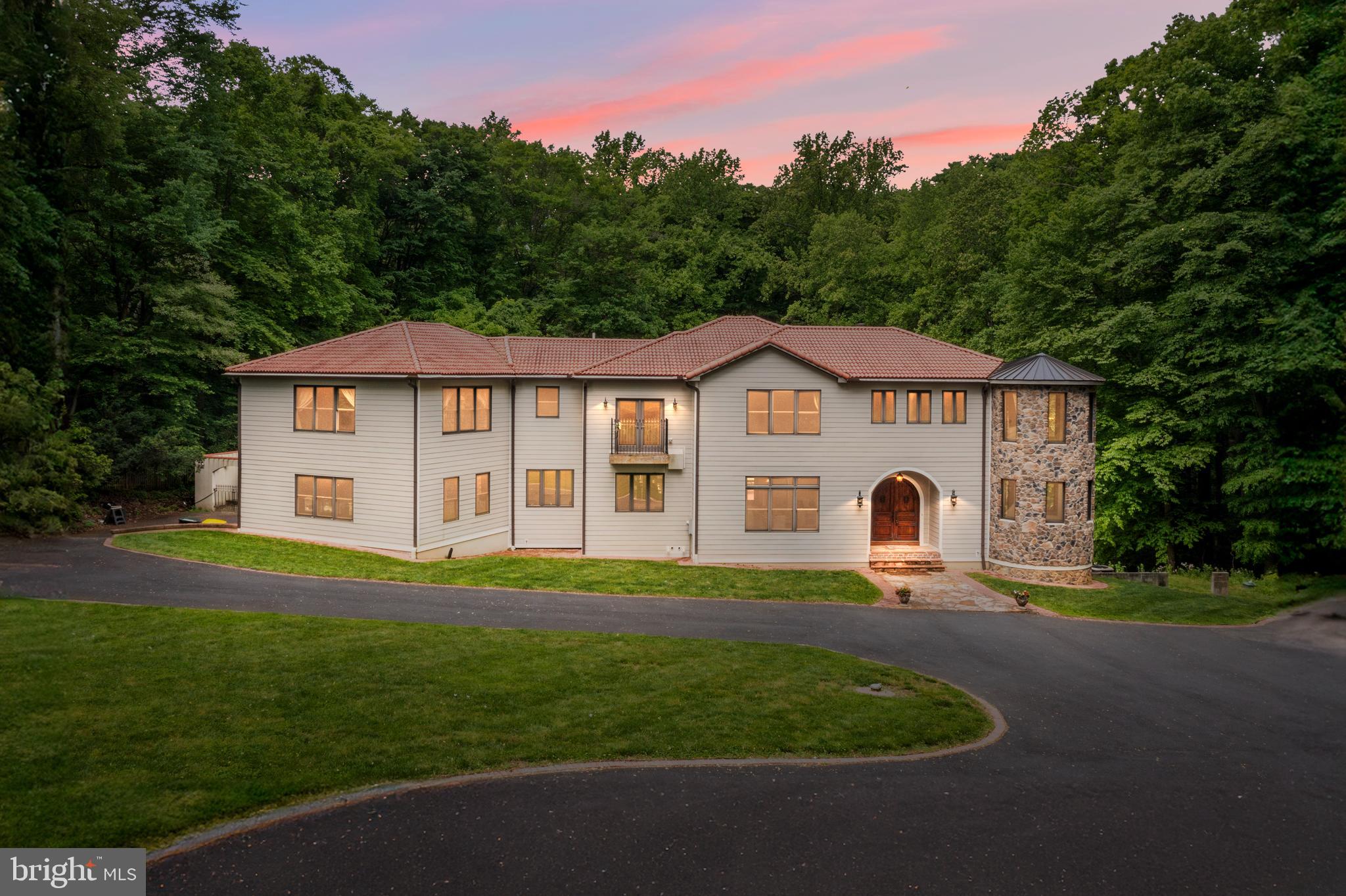 Welcome to 915 Mitchell Farm Lane. Situated at the end of a cul-de-sac on 2 acres of spectacular secluded grounds offering peaceful privacy in award-winning Unionville Chadds Ford School district. Indulge in the epitome of modern luxury living with this completely rebuilt, Mediterranean style 6,000+ sq.ft., five-bedroom residence offering a unique blend of indoor and outdoor entertaining at its finest. Bask in the tranquility of the lush grounds on the expansive two-tier back deck with a covered dining area overlooking the swimming pool and architectural landscaping wall, meticulously landscaped shrubs, and steps that lead down to a quaint pond. Entering the home you are greeted by a foyer area that leads directly into the expansive main living area that combines the family room with a gorgeous stone fireplace, formal dining, and a sun-filled, beautifully preserved silo that spans 2 floors of surrounding windows. The gourmet chef’s kitchen is complete with custom white cabinetry, an eight-burner stove with a hooded vent, a double oven, a beverage fridge, granite countertops, and an elevated bar for seating. The butler’s pantry adds to the convenience of a modern lifestyle. A guest bedroom is also located on the main floor overlooking the pool. Three more expansive bedrooms with en-suite baths are located on the second floor. The main suite has a large attached sitting/office area, a walk-in closet, and a spa-like bath. The lower level offers another area of luxurious living complete with a bar, den with fireplace, heated floors, and a fifth bedroom with bath. The property features a 2-car attached garage and many modern upgrades suited for luxury living. The pride of ownership is prominent throughout this wonderful home perched on secluded grounds that back up to the Brandywine Conservatory and still close enough to major roadways, shopping, and restaurants. Schedule your showing today to see this truly unique home for yourself.