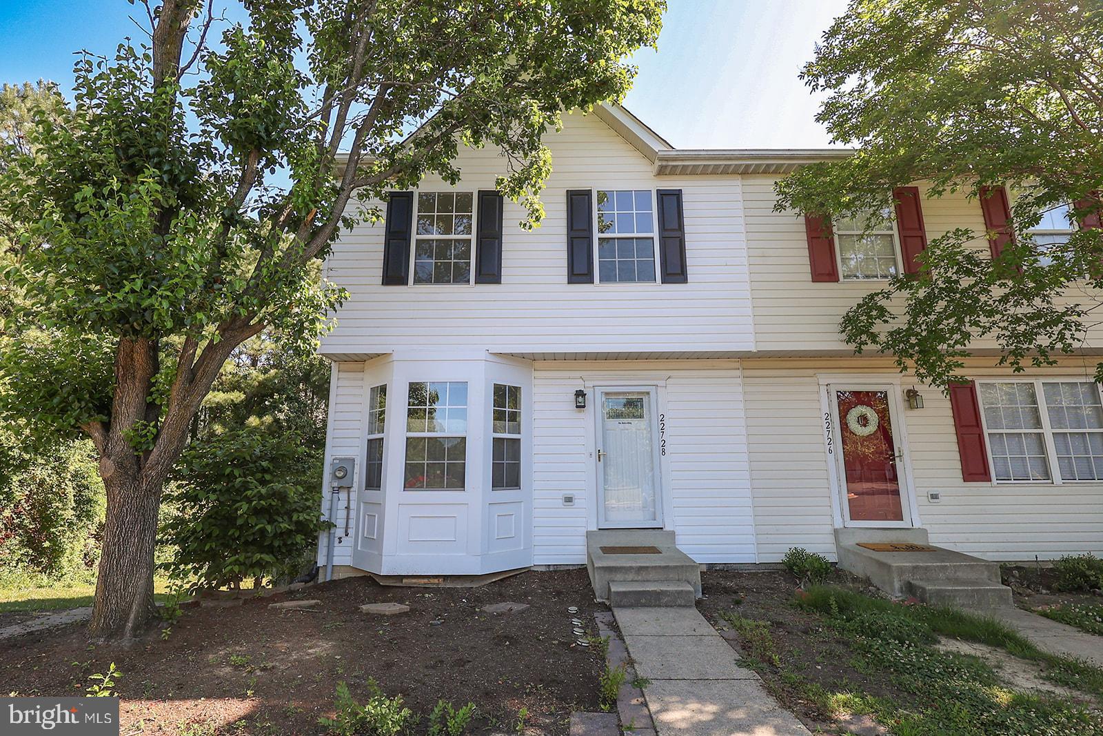 22728 Othello Lane offers a rare combination of flexibility, comfort, and income-producing potential in a  convenient California, Maryland location. This beautifully maintained end-unit townhome features 3 bedrooms, 3.5 baths, and a unique layout that opens the door to a variety of living arrangements. The standout feature is the fully furnished efficiency-style basement apartment, complete with its own private rear entrance, full bath, kitchenette, double closet, laundry area, and dedicated storage space. Whether you're looking for rental income, multi-generational living, a private guest suite, or a home office setup, this versatile lower level provides exceptional possibilities. The main and upper levels feature beautiful luxury vinyl plank flooring, fresh paint throughout, and an inviting open layout. The upgraded kitchen boasts KitchenAid appliances, solid surface countertops, and easy access to the spacious rear deck overlooking peaceful woods, creating the perfect setting for outdoor entertaining or relaxing in privacy.
Upstairs, you'll find two generously sized bedrooms along with a second laundry area. Both washers and dryers convey with the property, offering the convenience of two complete laundry setups. In total, the home includes 3 bedrooms, 3.5 baths, ample storage, and thoughtful updates throughout. Located close to shopping, restaurants, schools, and PAX River, this move-in-ready home combines convenience, privacy, and exceptional versatility—making it a standout opportunity for homeowners and investors alike.