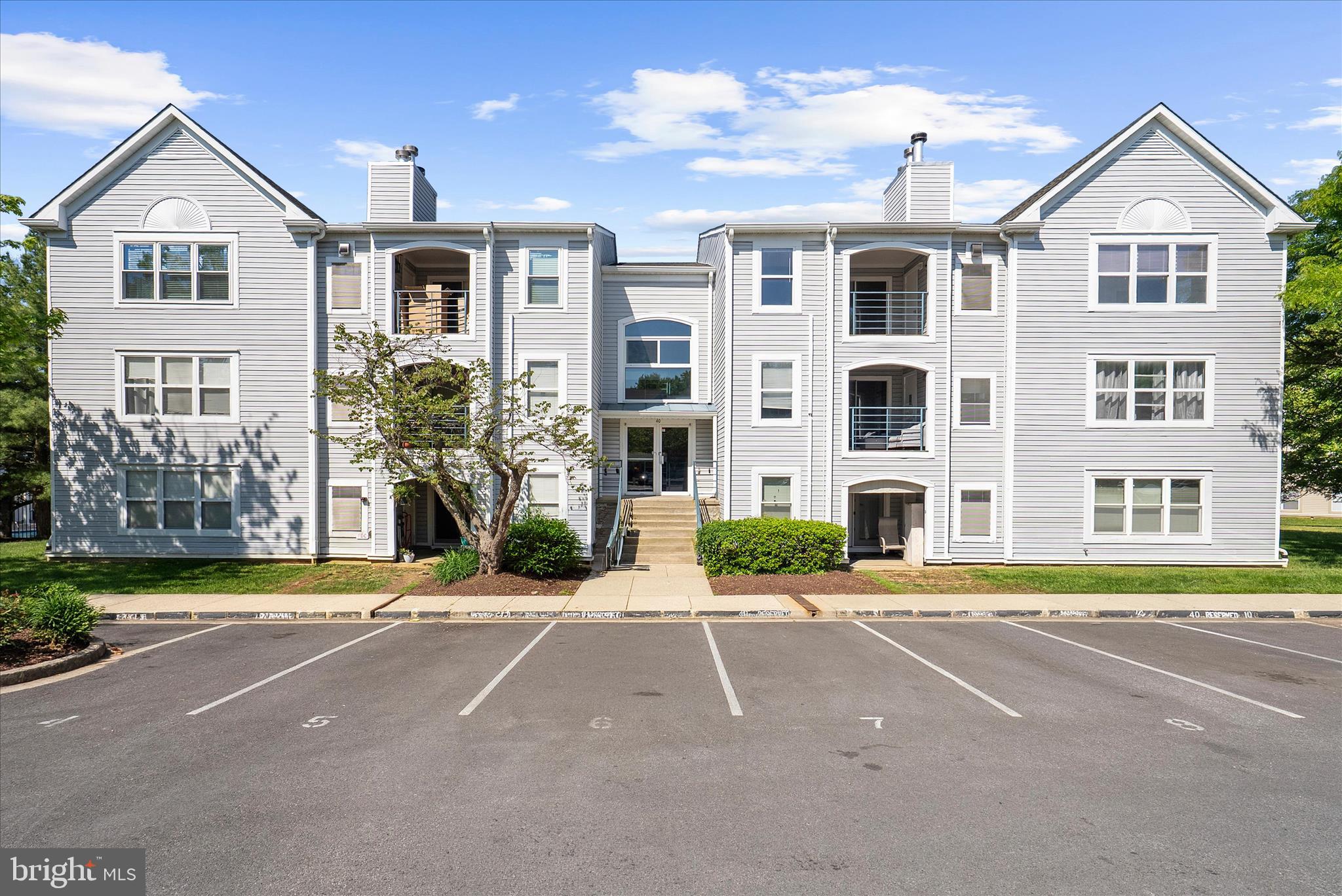 Welcome to this fully renovated penthouse condo in the highly desirable Annapolis Overlook community. This spacious 2-bedroom, 2-bath residence features soaring 10-foot ceilings in the main living area, creating an airy, open feel filled with natural light, along with a cozy wood-burning fireplace perfect for cooler evenings. The thoughtfully designed open-concept layout flows seamlessly from the living and dining spaces to the covered balcony — protected on three sides for year-round enjoyment — while the incredible cross breeze throughout the home makes temperate months especially enjoyable indoors.

Inside, nearly every surface has been updated with brand-new finishes, including luxury vinyl plank flooring, new carpet, new soft-close cabinetry, quartz countertops, stainless steel appliances, fresh paint, and fully renovated bathrooms. The spacious primary suite offers a walk-in closet and private en suite bath for added comfort and convenience.

Residents of Greystone Court enjoy secured building entry, beautifully maintained common grounds and green space, a fantastic outdoor pool, fitness center, and abundant guest parking. The unit also includes two parking spaces — one assigned and one permit parking space.

Ideally located with easy access to Downtown Annapolis, Washington D.C., and all major commuter routes, this home also places you moments from shopping, dining, and everyday conveniences. Modern, move-in ready, and perfectly located — this is condo living at its best.