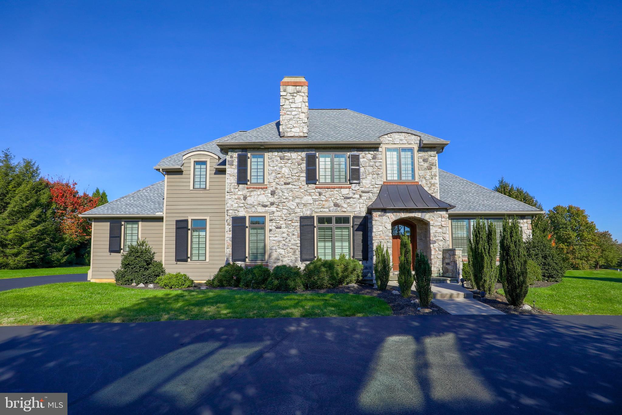 This gorgeous luxury home is set in a quiet neighborhood yet central to major highways, close to Lancaster City and Lititz Boro, with quick access to schools, parks, shopping, restaurants, and more. Spacious lot offers nearly an acre of well-maintained lawn and landscaping with a great back yard and covered back porch. First floor features a large primary suite with tray ceiling, crown molding, and private bath with soaking tub and walk-in Roman tile shower. Beautiful custom kitchen provides tons of granite counter space, high-end stainless steel Bosch appliances, huge “hidden” walk-in pantry, and plenty of seating for congregating. Second floor is currently set up as a mixture of bedrooms, office, and additional entertaining space but could easily set up to serve as up to 4 additional bedrooms and 2 additional full baths. Fully finished lower level is an entertainer’s dream with its wet bar space, recreation/TV area, exercise/gym with egress window, and full bath. Current workout room could be converted to a 6th bedroom if desired.