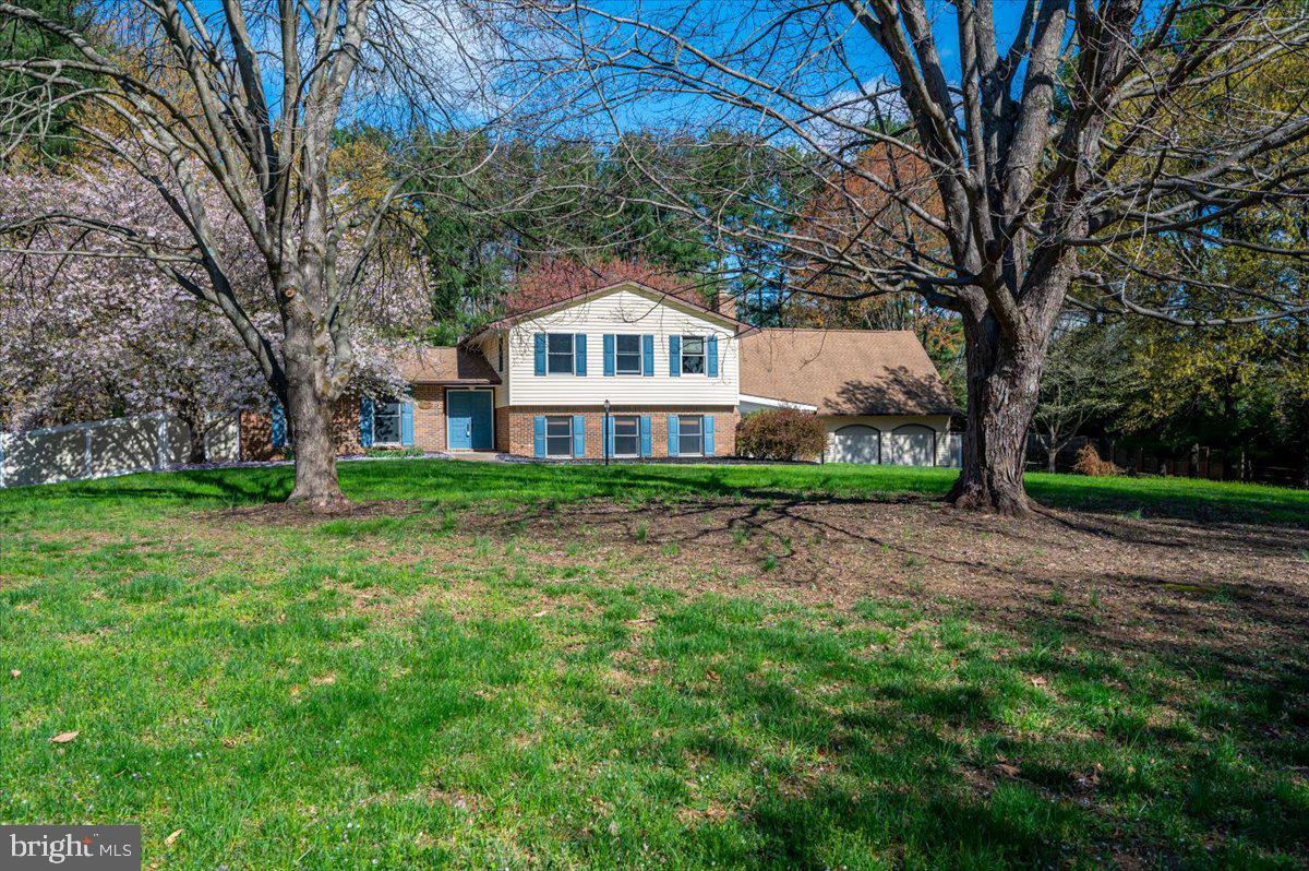 Stunning private retreat with all the amenities of desirable Ellicott City .  This 5 bedroom, 3 bath split with new huge home office (over all 3 garages) is ready to call home.  Beautifully appointed interior with cherry cabinets,granite countertops,  stainless appliances,  recessed lighting, ceiling fans, bamboo/tile/carpet porch and breezeway. Primary bedroom has it's own bath, 3 more bedrooms and 1 full bath on upper level.  Full finished lower level rec room with brick fireplace practically doubles your space.  The 5th bedroom and 3rd full bath are walk-out level to the yard; au pair ready or in-law suite?  Perfectly situated on1.25 acres of landscaped beauty, relax on your covered patio, make  s'mores on the built-in firepit while guests enjoy the oversized pool and spacious yard.  Parking with additional long driveway is a breeze. Enjoy all the culture, activities and fabulous BLUE RIBBON school in Howard County with easy commutes to everywhere.  We are ready for you!  PROFESSIONAL PICTURES COMING SOON.