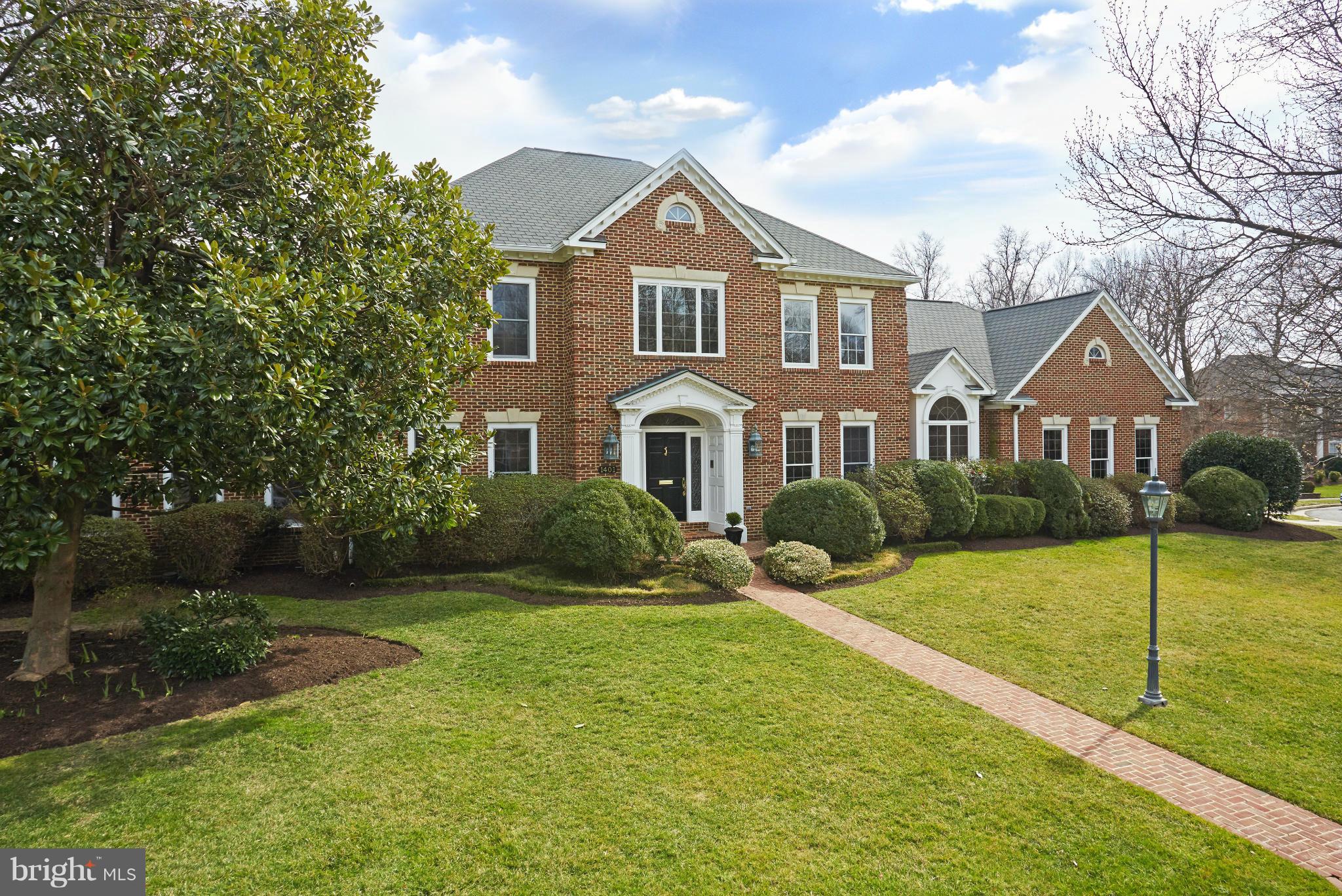 This is the one: AMAZING value for sure! Resting on an idyllic generous lot is this Georgian-style home w/soaring ceilings, gleaming wood floors, dramatic 2-story stone fireplace flanked by French doors to deck & pool (now open), state-of-the-art kitchen, adjoining breakfast rm, finished lower level with guest suite & recreational areas plus 3-car garage. Prime location, close to schools/work/fun!