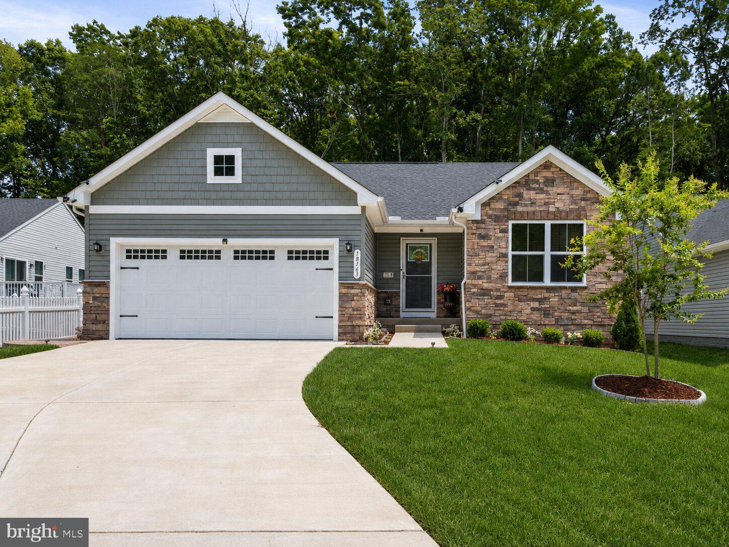 Welcome home to easy, comfortable living in this like new home constructed in 2024, where a thoughtfully designed main level, inviting gathering spaces, and a wooded backyard setting come together beautifully. LVP flooring carries through the home, creating a clean, cohesive feel, while the open layout makes everyday living and entertaining feel effortless.

At the heart of the home, the kitchen offers quartz countertops, white cabinetry, stainless steel appliances, and a generous center island with plenty of room for meal prep, casual conversations, and time spent together. The adjoining living and dining spaces provide a natural flow for hosting, relaxing, and enjoying the rhythms of daily life.

The main-level primary suite offers a private retreat, while two additional bedrooms provide flexibility for guests, a home office, hobbies, or changing household needs. Downstairs, the expansive lower level offers a recreation room, a fourth bedroom, full bathroom and valuable storage.  

Outdoor living is one of the home’s standout features. Step onto the covered screened porch for quiet mornings, relaxed dinners, or evenings overlooking the backyard. The adjoining patio and fenced yard create even more room to gather, garden, play, or simply unwind, all framed by a peaceful wooded backdrop.

An attached 2-car garage adds everyday convenience, while Pendleton offers an established community setting close to commuter routes and local amenities. This is a home designed for comfortable main-level living, easy entertaining, and enjoying more time both indoors and out. Some photos have been virtually staged to help illustrate the potential use and layout of the spaces