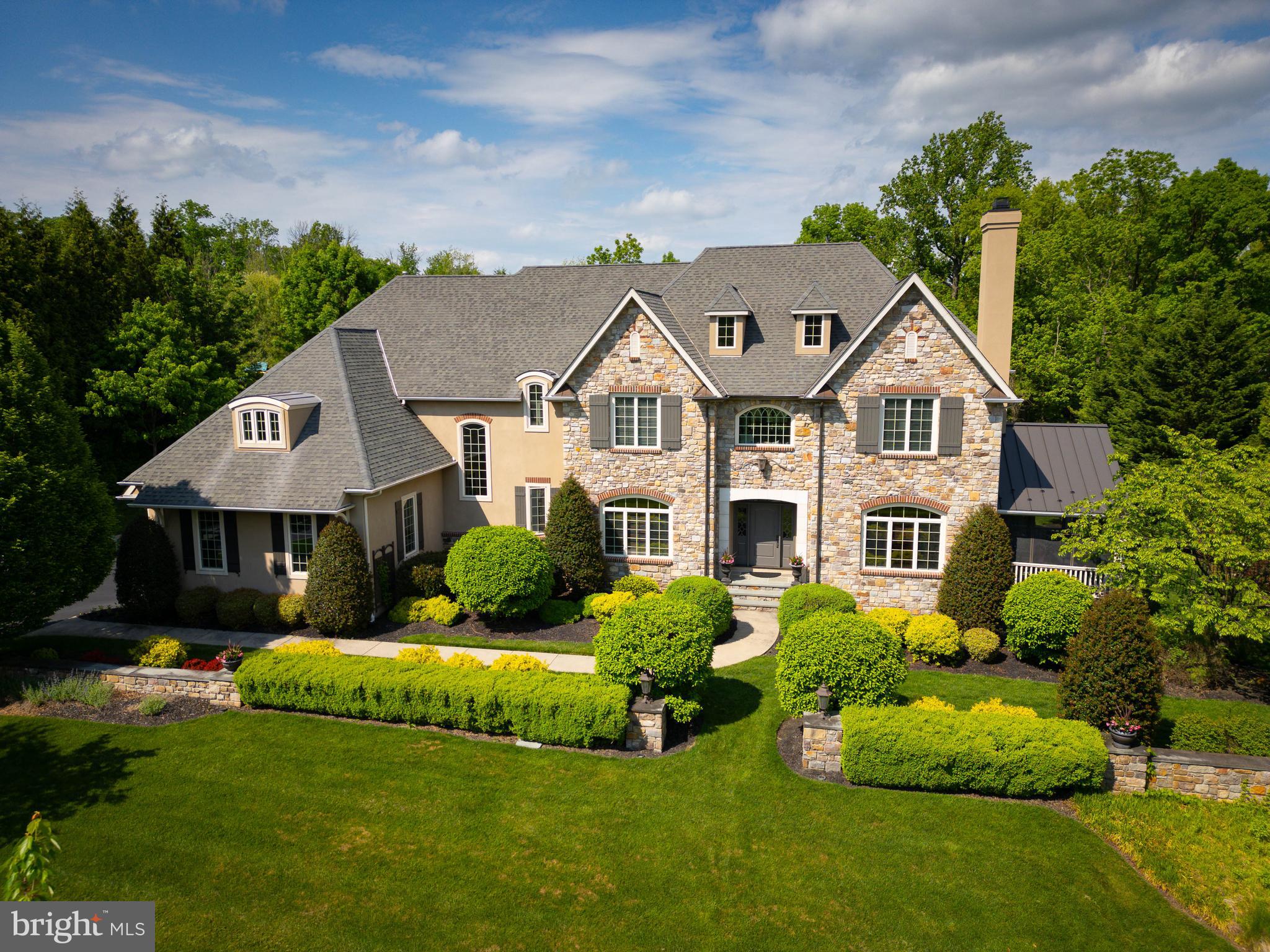 Did you know that we are less than 50 days away from Memorial Day Weekend which is the unofficial start of SUMMER.  How will you enjoy your summer this year? If you've driven by this home, chances are its magnetic curb appeal caught your attention, inviting you to explore further into the charm of this property nestled on nearly an acre, showcasing its captivating backyard oasis! The rear yard, a retreat for all seasons, features a heated SALTWATER pool, hot tub, pool pavilion, and firepit—always ready for year round enjoyment. Constructed in 2007, the current owners have masterfully transformed it into a sophisticated haven. Step through the striking front door to discover high ceilings and elegant details. The Living Room offers a cozy space with a fireplace and custom bookcases. The screened-in porch, a perennial favorite for gatherings in three out of the four seasons, beckons from either side of the room. The Dining Room is generously sized and vibrant, with access to the expansive Butler's Pantry—an invaluable asset for hosting large gatherings. The thoughtfully designed Chef's Kitchen boasts every essential, complemented by a central island and a Breakfast Room with a view of the rear yard. The adjacent Family Room, bathed in natural light and featuring a vaulted ceiling, a second fireplace, and patio access, serves as the heart of this elegant home. A substantial home office, formal and informal powder rooms, a regal Laundry Room, complete with a second-floor laundry chute, a spacious mudroom, and pantry round out the main floor. Ascend to the second floor to appreciate the architectural details and the deliberate separation of the Owner's Suite from the remaining four bedrooms. The Owner's Suite exudes opulence, offering an expansive yet cozy retreat with walk-in closets and a full bath featuring separate vanities, a soaking tub, stall shower, and WC. Two additional bedrooms boast en-suite privileges, while the other two share an adjoining bath, demonstrating a skillful balance of privacy in shared spaces. The Lower Level, with walk-out access to the expansive rear yard, houses a finished full basement with a Den, Game Room, Wine Room, Gym, the home's fifth full bath, and abundant storage. Enjoy access to major roadways and highways, convenient shopping, numerous eateries, and restaurants. Top Ranked Wissahickon Schools enhance all the reasons why you should make this home yours. Call for your private tour TODAY!