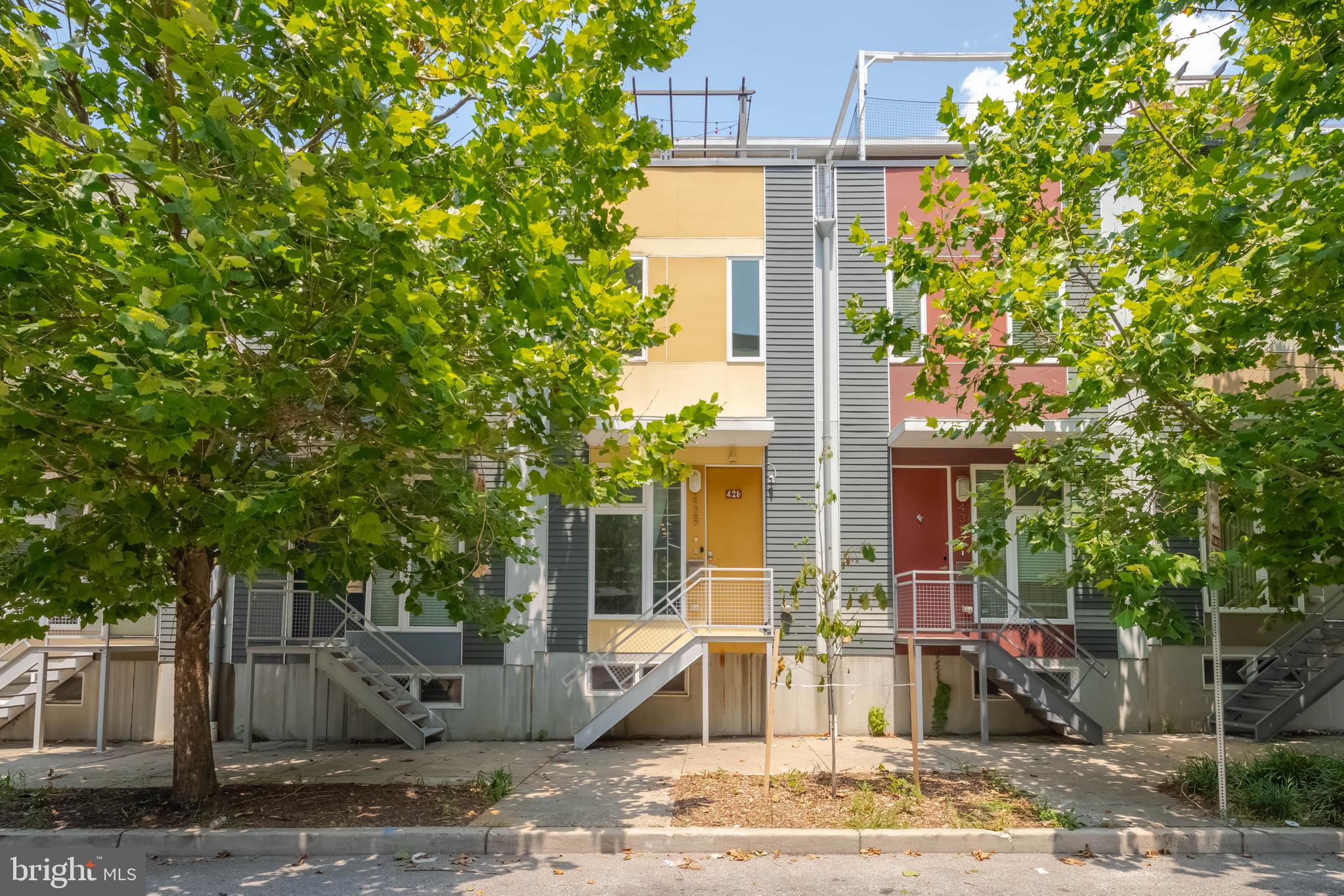 Contemporary three bedroom, two-and-a-half-bathroom home nestled in the vibrant neighborhood of the Station North Arts District offers an exceptional living experience. With an array of modern features, including stainless steel appliances with a smart oven and built-in air fryer, a smart home thermostat for convenience and comfort, an open floor plan with hardwood floors, very sizable bedrooms and private parking pad. The versatile, finished basement provides additional living space and tons of storage. The home spans four fully finished levels, a rooftop Trex deck that offers stunning city light views. Located near the Open Works Makers studio, art galleries, and the Station North Tool Library, perfectly positioned for creative enthusiasts. Just down the block, you'll find a community garden, Guilford Hall Brewing, coffee shops, ample restaurants and an easy walk to Mt. Vernon, Charles Street, Penn Station, the University of Baltimore, MICA, and so much more. This home seamlessly blends contemporary features with the rich, artistic culture of the neighborhood. Don’t miss the chance to experience all it has to offer!