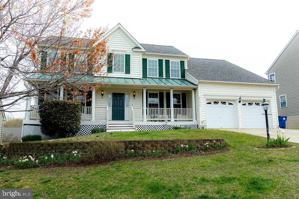 This beautiful two-story Colonial with a finished basement is perfectly situated in a prime location just minutes from downtown Leonardtown, offering easy access to quaint shops, restaurants, the wharf, and vibrant community events. With a traditional floor plan, the main level features durable vinyl plank flooring, a welcoming living room with a cozy gas fireplace, and a functional kitchen with granite countertops, a center island, stainless steel appliances, and a pantry. A separate dining room provides the perfect space for formal gatherings, while a convenient powder room completes the main floor.

Upstairs, you'll find fresh new carpeting that extends throughout  three generously sized bedrooms sharing a full bath, along with a spacious primary suite that boasts two walk-in closets and an upgraded connecting  bath featuring a corner soaking tub, a beautifully tiled shower, and a double sink vanity. The finished lower level offers an expansive recreation room, a flexible space ideal for a home office, gym, or guest area, and a full bath for added convenience.

Outside, the spacious composite deck with vinyl railings provides the perfect spot for entertaining, overlooking a fully fenced backyard. Additional highlights include a two-car garage and a brand-new roof. This home perfectly balances convenience and charm!