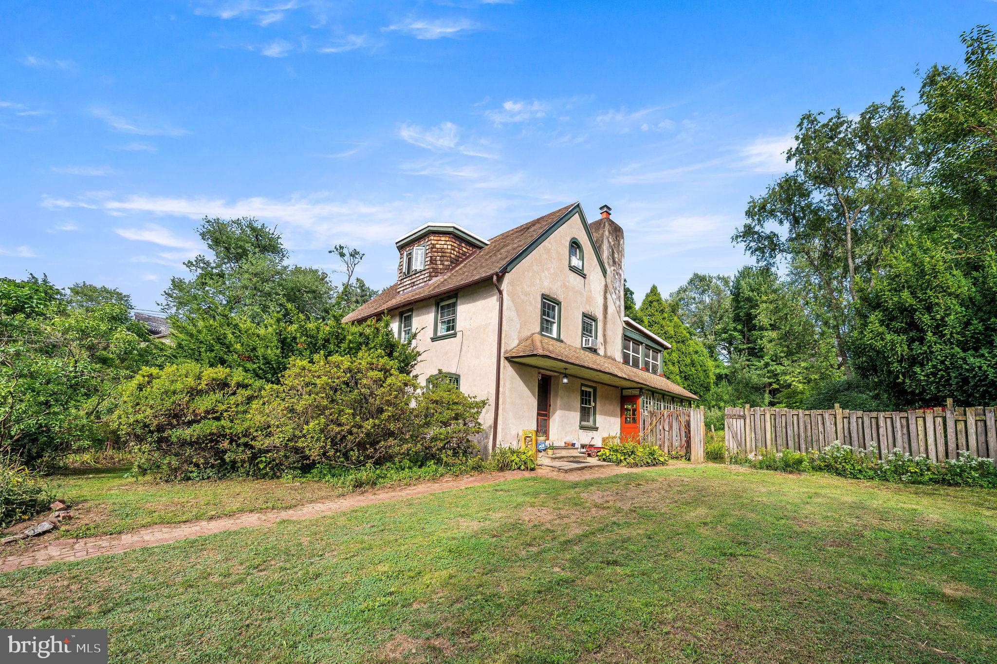 A Rare Urban Oasis in Germantown on an Expansive Lot! Welcome to 408 E Woodlawn Street, a one-of-a-kind property that seamlessly blends urban convenience with the tranquility of nature. Nestled on an unparalleled lot with over 90 feet of frontage and 280 feet of depth, this home offers an extraordinary outdoor retreat—complete with a lush rear garden, a chicken coop, and a private bamboo-lined side yard for ultimate seclusion. Step inside to discover a spacious and inviting layout. Originally built as a honeymoon cottage, you will immediately be enamored by the heart-shaped cutouts featured on the staircase and 13 inch deep window trim surrounding the property. The main floor welcomes you into the living room, leading to a formal dining area and a generously sized kitchen. A convenient laundry room and a sun-drenched sunroom offer additional space, with direct access to the massive backyard—perfect for gardening, entertaining, or simply unwinding on the rear patio. Upstairs, the primary bedroom features an enclosed sleeping porch, creating a serene space to enjoy your morning coffee or a peaceful evening escape. With five total bedrooms, there's plenty of room to grow, host guests, or design a dedicated home office. This rare gem delivers the best of both worlds—a sprawling private retreat in the heart of Germantown. Whether you're drawn to the expansive outdoor space, the charming interior, or the endless possibilities this property offers, 408 E Woodlawn Street is a must-see. Schedule your showing today and experience this hidden urban sanctuary for yourself!