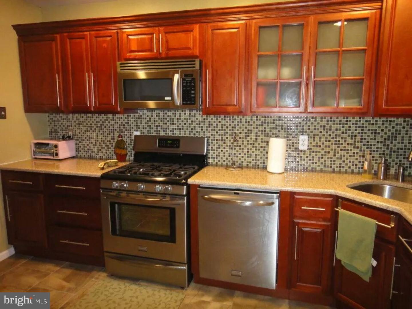 This is a charming house with newly renovated kitchen, the stainless steel appliances are included in the purchase. The bathroom is also newly renovated, it's breathtaking. The laundry room is right outside of the kitchen and the washer and dryer are included in the purchase. The property has a detached garage, with an automatic garage door opener access is through the yard which  is completely cemented and has privacy fencing installed. The alarm system is high tech with great features.  This hidden jewel is truly a wonderful see for you to appreciate the amenities that this home offers.