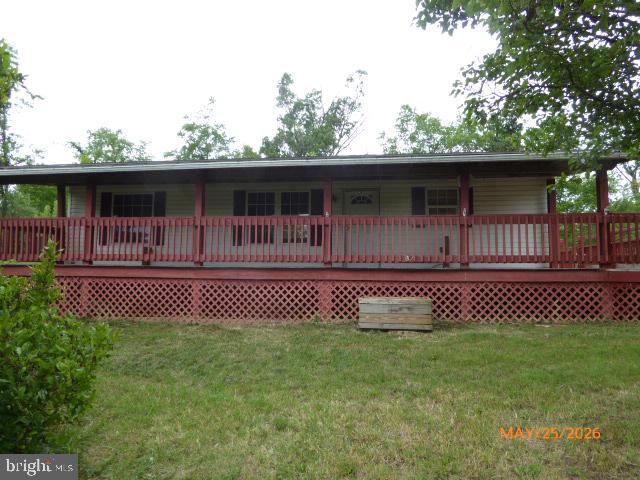 CALL NOW TO SEE THIS 3 BEDROOM, 2 BATH MANUFACTURED HOME WITH 2 ACRES OF OPEN GROUND, LARGE COVERED FRONT PORCH WITH SIDE DECK. THERE IS ALSO A DETACHED TWO CAR METAL GARAGE AND TWO STORAGE SHEDS.
