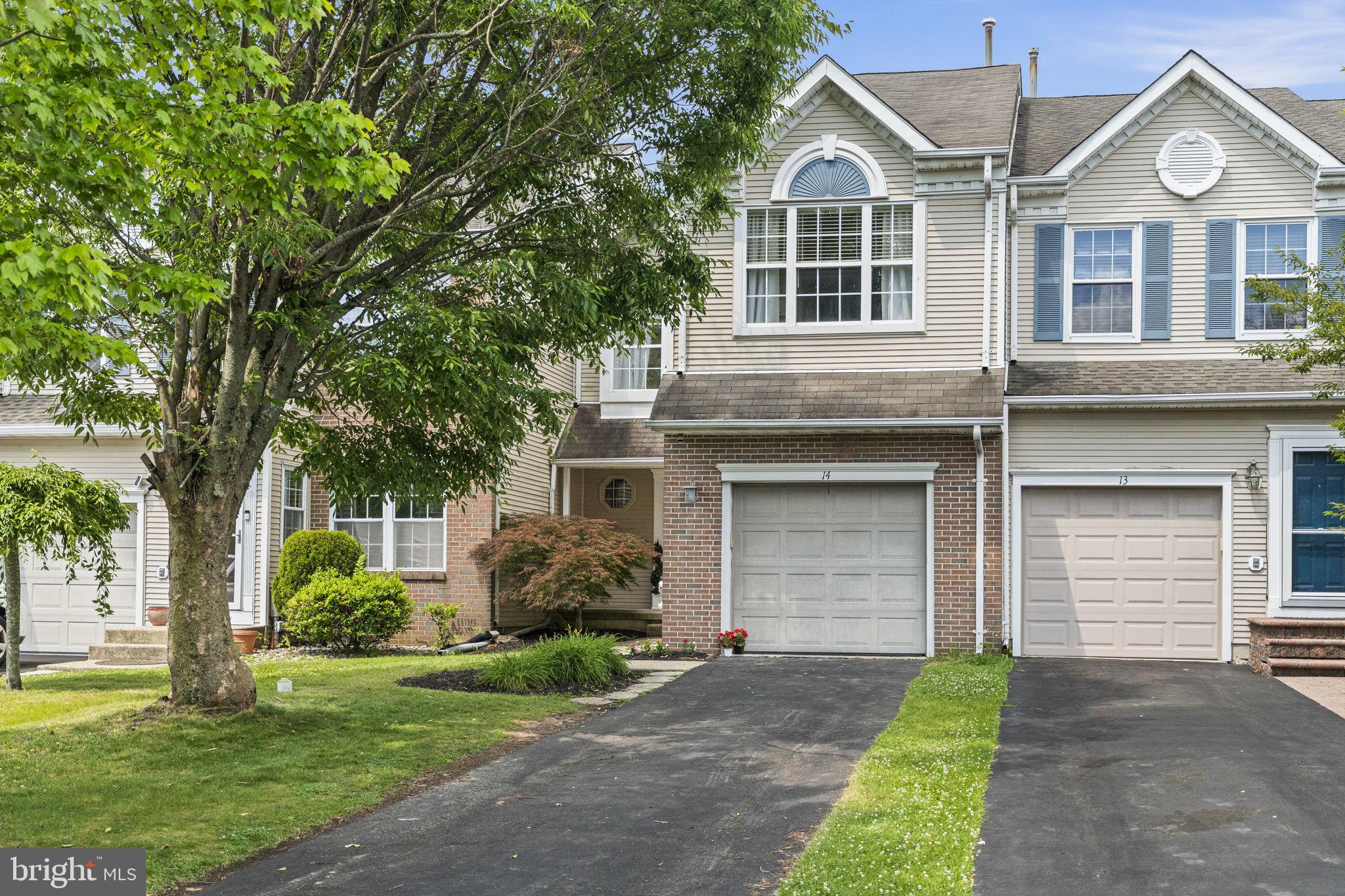 Welcome to 14 Sparrow Walk, a beautifully updated three-bedroom, two-and-a-half-bathroom townhome offering an exceptional lifestyle opportunity in the highly coveted Newtown Grant community. Perfectly blending easy, low-maintenance living with a spacious and versatile layout, this home appeals equally to those looking to simplify their lifestyle without sacrificing high-end features, as well as anyone wanting to anchor themselves in the award-winning Council Rock School District (Council Rock North). The property is ideally positioned right at the entrance of a quiet, no-outlet cul-de-sac street with zero through traffic, ensuring a peaceful and safe setting. Step inside and you are immediately greeted by the home's primary architectural showstopper: a dramatic two-story family room. While other models in the neighborhood sacrifice this overhead volume for extra upstairs square footage, the incredible open air and soaring windows here create a grand, sun-drenched living environment that makes the main floor feel exceptionally bright and open. The seamless flow leads right into the eat-in kitchen, featuring a timeless, neutral cabinet aesthetic paired with durable stone countertops, making it an ideal hub for both daily life and effortless entertaining.

Directly off the main living space, a glass slider opens to a private rear deck looking out over a premium, serene backdrop. The home backs directly onto a protected, green preserved meadow space, serving as a beautiful, built-in visual extension of your backyard where you can enjoy long-distance green views with total privacy. Upstairs, the primary bedroom serves as a true retreat, highlighted by a primary bathroom that has been fully rebuilt from top to bottom with custom finishes. Additionally, the open loft area has been seamlessly converted into a formal third bedroom, providing excellent space flexibility for a growing household, guests, or a dedicated work-from-home office.

What truly separates this property from the rest of the market is its fully finished basement—a rare and premium asset found on only a few select streets within Newtown Grant. Outfitted with fresh carpeting, this expansive lower level offers the perfect footprint for a secondary media room, home gym, hobby space, or a comfortable spot for visiting family. Living here means enjoying remarkably low monthly HOA fees while gaining complete access to a resort-style amenity package, featuring a massive in-ground community pool and the neighborhood's outdoor pickleball courts. Combining turnkey interior upgrades, a highly coveted finished basement layout, and an unbeatable location just minutes from the dining and boutique shopping of historic Newtown Borough, this home delivers a perfect match for any stage of life.