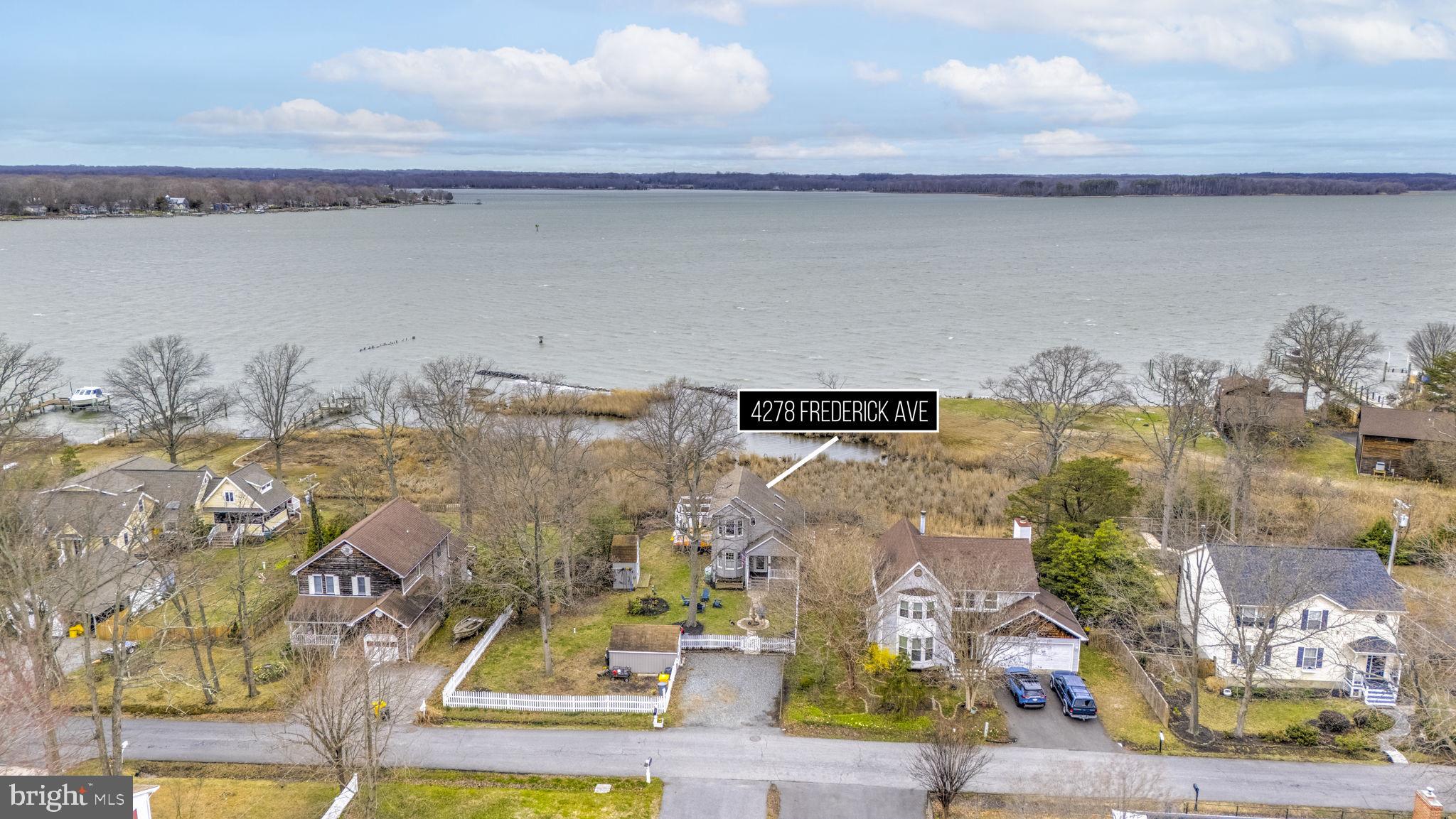 Unobstructed, non-riparian waterfront with sweeping panoramic views of the scenic West River. If you’re searching for stunning water views and a home perfectly positioned to capture breathtaking sunsets over the river, this is the one. Inside, you’ll fall in love with the home’s open, contemporary design that maximizes the surrounding views. The upgraded kitchen features granite countertops, stainless steel appliances, and durable LVP flooring throughout. The dining area is warm and inviting with a cozy pellet stove, while the living room boasts vaulted ceilings. Sliding doors lead to a waterside rear deck—complete with a hot tub—making it an ideal space for entertaining or relaxing by the water. The main level includes a comfortable bedroom (Murphy bed coveys) and a full bath. Upstairs, you’ll find the primary bedroom, a guest bedroom, and another full bath. The primary suite features sliding doors to a private upper waterside deck—perfect for enjoying your morning coffee while watching the waterfowl over the West River. The community enhances the waterfront lifestyle with a pier and small water access area for swimming or launching your kayak. Come experience the relaxed charm and natural beauty of the Chesapeake Bay lifestyle.