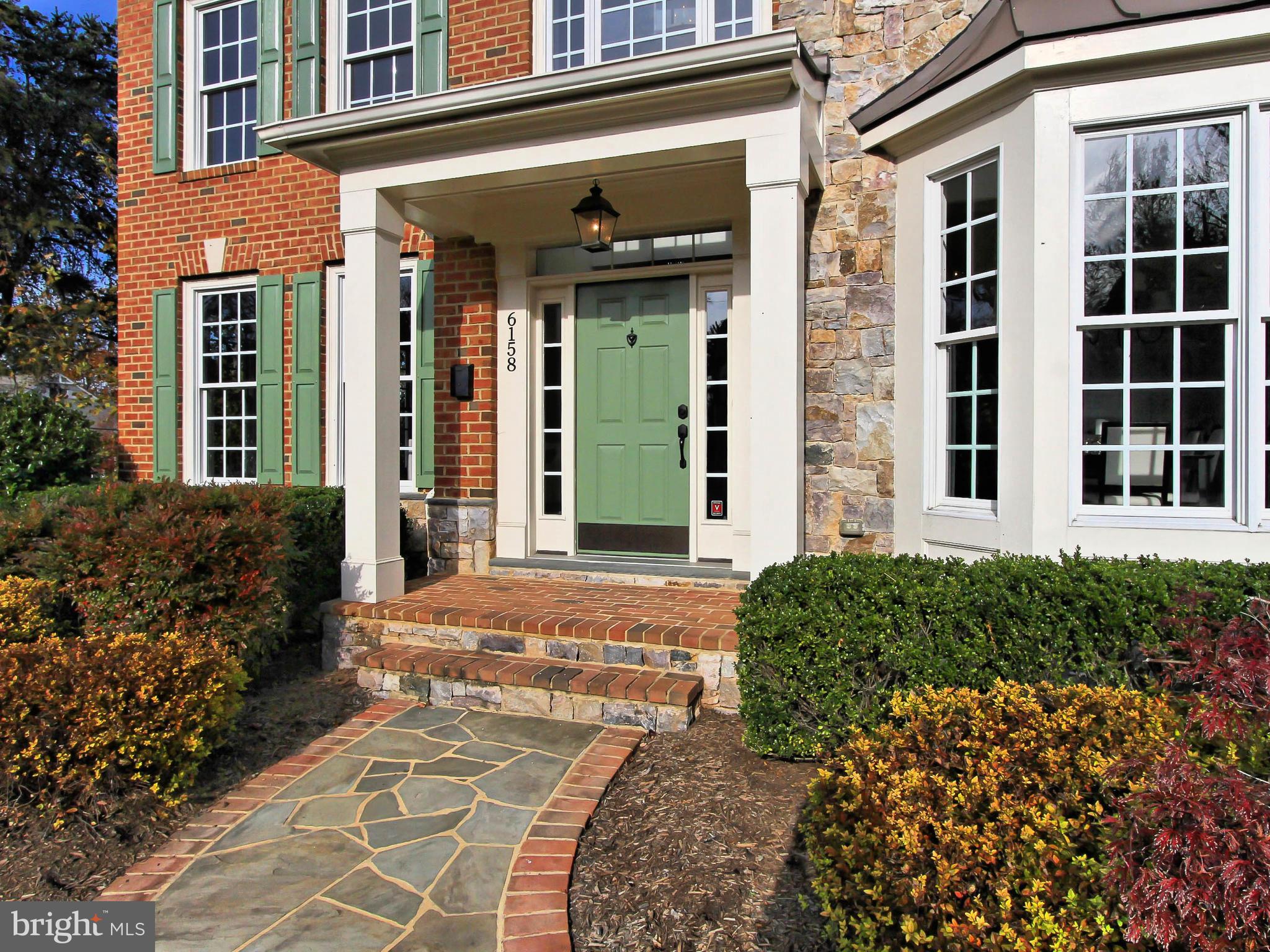 Gorgeous all brick and stone home, close to shopping and downtown McLean.  The hand finished dark hardwood floors and contrasting white/white walls with custom moldings are stunning - the perfect background for furniture and art. Based on an architectural design that emphasizes "borrowed views" each room on the main level has a view into the adjacent room.  Open the front door and the true center hall plan offers a view through the house to the rear yard; the living room has a view to the library and dining room to kitchen. The chef's kitchen features painted cabinets, stainless Monogram appliances, center island with prep sink and breakfast area, all open to a light filled family room with an 11' ceiling and gas fireplace. The front and rear stairs are hardwood as are the stairs to the 4th level loft and the stairs to the lower level. Upstairs there's a guest bedroom with en-suite bath, 2 other bedrooms that share the hall bath and a large laundry/craft room with cabinets and a deep utility sink. Double doors open to the master suite with sitting room and fireplace. There is a 4th level loft with beamed ceiling & full bath and a fully finished walkout lower level with rec-room, media room, exercise/game room, huge wet bar, eating area, bedroom and full bath, perfect for family activities, entertaining or for an in-law/ au-pair suite. 4 levels, 5 bedrooms, 5 1/2 baths, 4 fireplaces. This home is a must see!