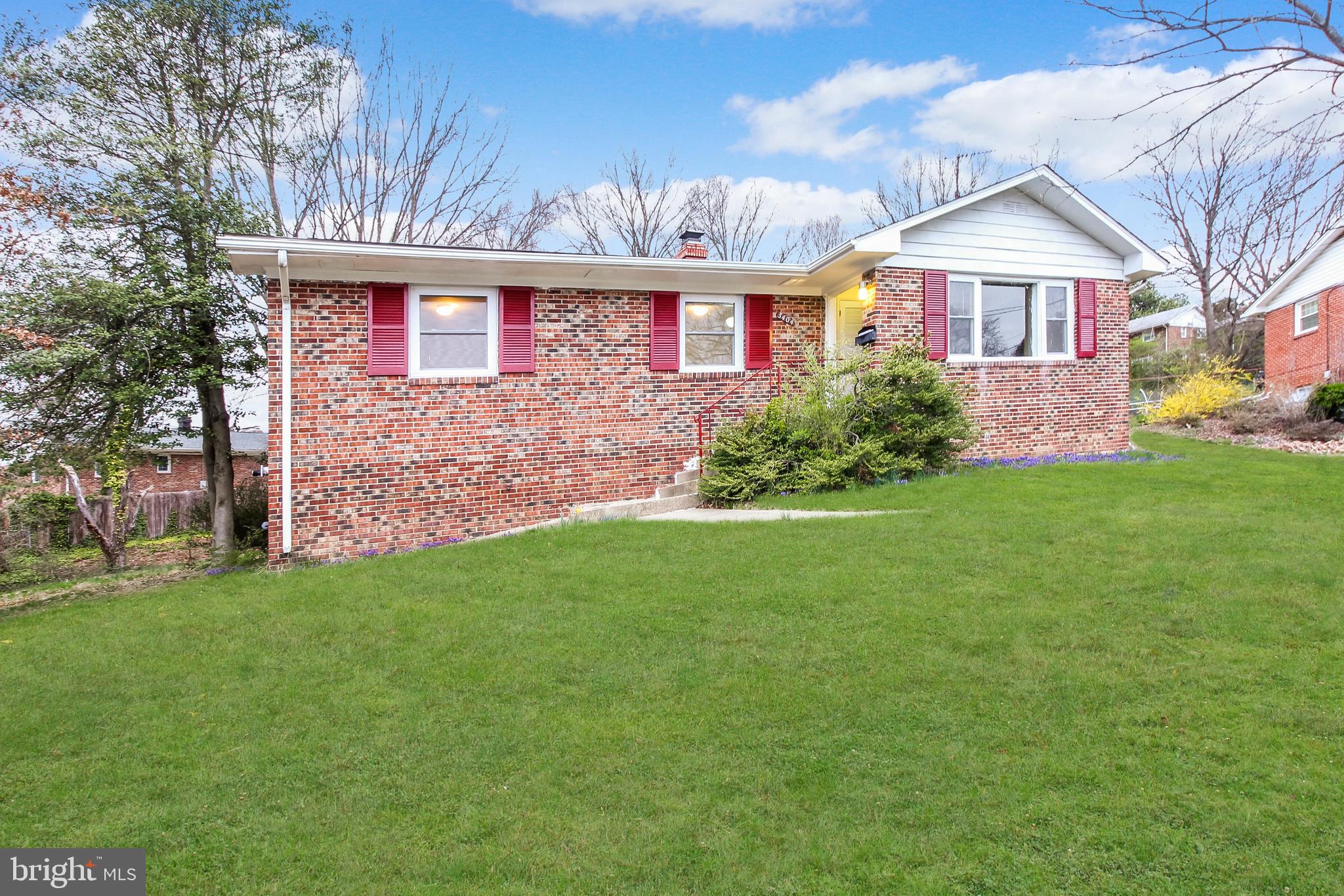 Brick rambler with 3 bedroom and 2 baths on main level and possible 2 additional bedrooms on lower level and full bath. Hardwood floors on main level with florida room off kitchen. Enclosed rear porch. Large newly finished rec room in lower level with new cabinets, sink & granite counters. Walkout basement to nice size back yard. Parking pad. Located in quaint College Park Wood community.