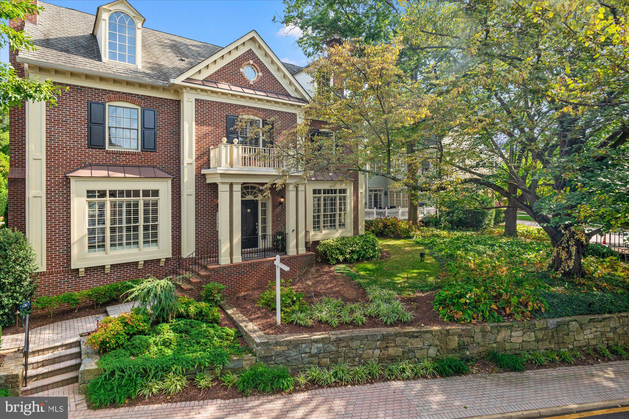 Welcome to this stately and elegant all-brick Colonial residence, perfectly situated in the highly coveted Evans Farm gated community. Spanning approximately 7,500 square feet across four luxurious levels, this 6 bedroom, 5.5 bath home is a true masterpiece of architectural design and craftsmanship.

Step inside and be greeted by the grand double-story foyer with a stunning crystal chandelier that sets the tone for the elegance found throughout. The home boasts exquisite trims and molding, with rich hardwood floors gracing both the main and upper levels. Soaring ceilings and expansive windows flood the space with natural light, highlighting the luxurious finishes and meticulous attention to detail.

The heart of this home is the gourmet kitchen, featuring a Viking gas range with a vent hood, a Sub-Zero refrigerator, and a spacious eat-in area. A convenient pantry and adjacent family room, with a striking stone-surround gas fireplace, create a perfect space for both entertaining and everyday living. Tall windows offer a picturesque view of the inviting brick-paved courtyard, perfect for outdoor gatherings.

For those who appreciate refined living, the formal dining room, complete with its own gas-burning fireplace, is ideal for hosting elegant dinners. The sophisticated living room, also with a gas fireplace, provides a serene setting for relaxation. The library is a book lover's dream, with custom-built cabinetry, half-wall paneling, and extensive bookshelves, offering a quiet retreat for study or work.

The upper levels are equally impressive, with a spacious primary suite that serves as a luxurious sanctuary. This suite includes a cozy sitting room, three walk-in closets with custom organizational systems, and an expansive primary bathroom. The bathroom features dual vanities, a large jacuzzi tub, marble floors and vanity tops, a walk-in shower, and a separate water closet. The secondary bedrooms are generously sized, providing comfort and privacy for family and guests. A large laundry room with ample cabinetry and a utility sink adds convenience to the upper level.

On the fourth level, discover a large versatile space with a living area, full bathroom and bedroom currently outfitted with custom cabinetry, perfect for a home office, study, or an au-pair suite. 

The lower level is an entertainer's delight, offering a spacious game room with built-in cabinets and a stone-surround gas fireplace, a large wet bar, an exercise room/additional bedroom with en-suite full bath, and a substantial workshop area. Additionally, there is ample storage space for all your needs.

Outside, the property is beautifully landscaped with flowerbeds and hardscaping that complement the home's timeless appeal. The rear-loading three-car garage provides both convenience and additional storage options.

This home is further enhanced by an elevator for ease of access across all levels and an irrigation system to maintain the pristine exterior. Elegant, luxurious, and meticulously designed, this home offers the perfect blend of classic charm and modern convenience in one of the most sought-after neighborhoods.

Evans Farm is a gated community of 143 luxury residences in McLean, Virginia, situated on the historic site of the former Evans Farm between Chain Bridge Road and Dolley Madison Boulevard, close to the George Washington Parkway and Potomac River. The developers preserved the old mill house, farming machinery, and century-old trees, enhancing the historic ambiance with new plantings around the pond and Stonehouse. These landmarks serve as gathering places for residents and beautification of the neighborhood, maintaining its charm. Evans Farm is conveniently located near shopping and dining in downtown McLean, with easy access to GW Parkway, making downtown DC a 20–30 minute drive and Tysons Corner just minutes away.