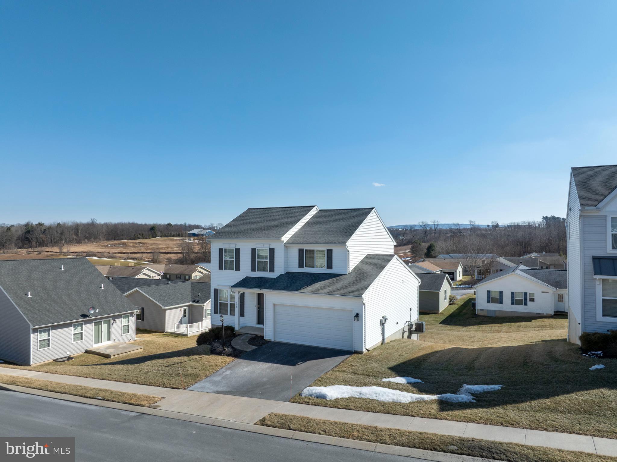 Located in the Village of Nittany Glen, this Berks Homes Bellewoode floorplan offers a comfortable two‑story layout with 3 bedrooms and 2.5 baths. The main level is bright with natural light and features open living and dining spaces that connect to a beautiful kitchen with island and sliding doors to the deck. A first‑floor laundry room, half bath and 2‑car garage add everyday convenience. Upstairs, the primary bedroom includes a walk‑in closet and nicely appointed ensuite bath, along with two additional bedrooms and a full bath. The walkout lower level provides excellent storage or future finishing potential. Residents of Nittany Glen enjoy a community clubhouse, fitness room, pool, sidewalks, and green spaces, all within a peaceful neighborhood setting. The location offers quick access to shopping, dining, Penn State, and the State College Regional Airport, making this home a great opportunity in a desirable community. Schedule your showing today!
