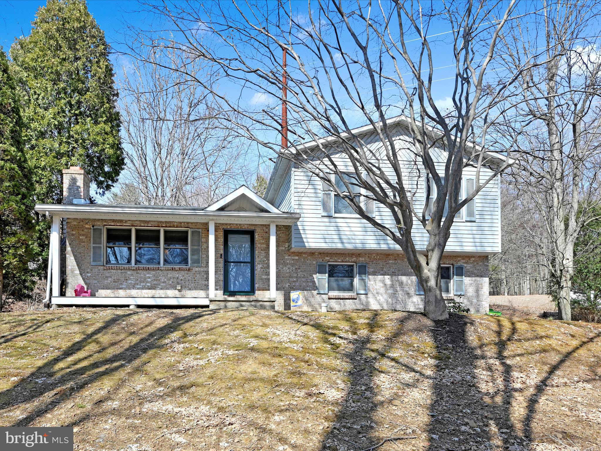 This home at 471 Seltzer Road  in Norwegian Township  is in a beautiful private wooded setting. It’s situated on .6 acre lot with a private rear deck and quaint front porch. This split level home has a large kitchen with granite counter tops with a breakfast bar and ceramic tile floor. The family room has vaulted ceilings brick/propane fireplace and sliding doors that exit to the rear deck. The living room, dining room and family room all have cherry hardwood floors. The living room fireplace has a coal insert that is currently used for heat. The upper level has 3 bedrooms, 1 full bathroom beautifully tiled,  and large primary bedroom walk-in closet. Laundry area located off the garage. Schedule your showing today!
