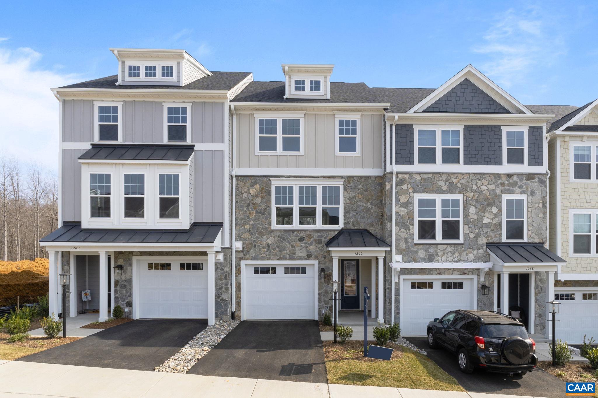 This Holly townhome is located in the Brookhill neighborhood, a peaceful, wooded setting just off Route 29. Estimated for an early 2027 completion, the bright, open layout features a spacious galley kitchen, maintenance-free deck, and attached 1-car garage with extra storage. The first floor includes a flexible rec room and half bath, offering space for a home office, workout area, or casual living room. The second floor features the main living area with a large family room, kitchen and dining area, completed with a walk-in pantry and half bathroom. The third floor includes a large primary suite with attached bathroom, hall laundry closet, two additional bedrooms and a shared hall bathroom. Residents will enjoy access to parks, walking trails, tennis courts, tot lots, and more. Photos are similar and may show optional features. Make design selections today!,Granite Counter,Painted Cabinets