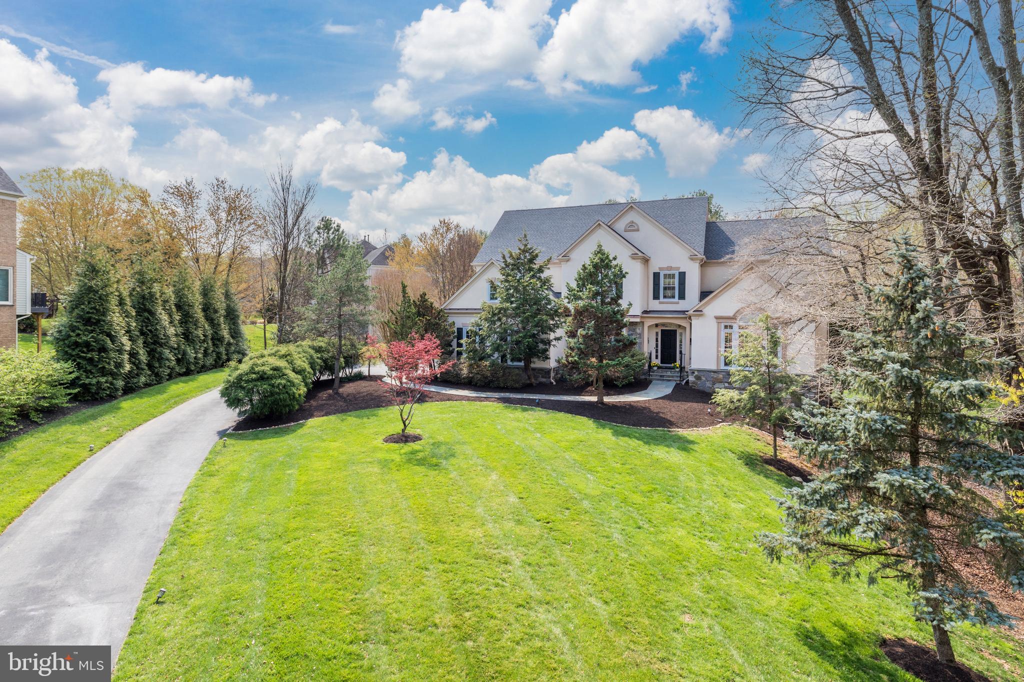 Beautiful light filled home with over 7300 sf of living with open floor plan and soaring ceilings and walls of windows.   Huge remodeled kitchen with sitting room, fireplace and breakfast nook. Gorgeous Outdoor Living with pool, newer upper and lower level deck . Main Level owner's suite with luxury bath.    Dramatic Great Room/Family Room with gas fireplace. Spacious library with coffered ceiling. Four bedrooms and three baths on the upper level (one is large guest suite with an ensuite bath, a Cedar Lined WIC and a 2nd WIC).  Finished walkout Lower Level  with 8' ceilings,  Recreation Room, Game Room with Wet Bar featuring refreshment fridge, microwave and sink;  Billiards Room, Sauna, Wine Room & Media Room, Exercise Room, Two additional bedrooms and a full bath, and a storage room with shelving and a utility sink.  Major upgrades include roof, deck and windows (all in 2017).