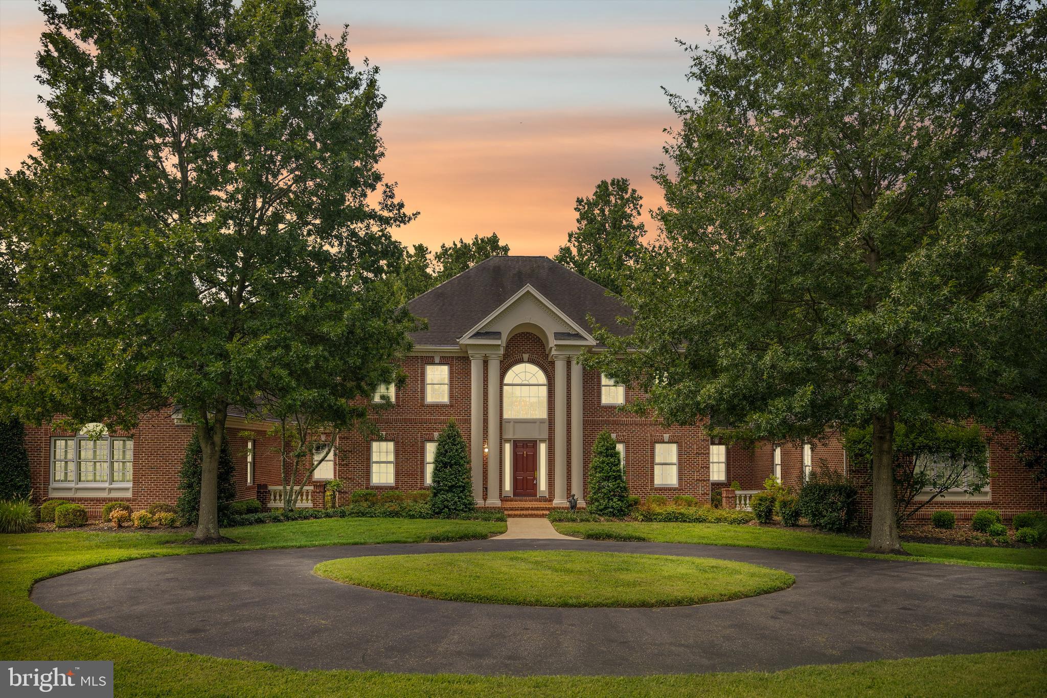 REASONABLE OFFERS WILL BE CONSIDERED!

COTTAGE FARM ESTATES — Welcome to this  STUNNING 6 Bedroom, 5 Full & 2 Half Bath Custom-Built Colonial on 8.11 Acres of Impeccably Landscaped Maryland Countryside --  In sought-after Cottage Farm Estates.

This custom-built masterpiece is a true showcase of craftsmanship, luxury, and timeless design, boasting over 8 acres of serene privacy and meticulous landscaping by Homestead Gardens.

Step into the grandeur of a marble-floored foyer featuring a gorgeous, curved staircase, complemented by a secondary back staircase for convenience and flow. The soaring 10'6" ceilings on the main level and 9'6" ceilings on the second floor create an open, airy elegance throughout.

The immaculate gourmet kitchen is designed for the serious chef with two distinct prep zones—a cooking side and a baking side. It features:

·        10-burner professional-grade stove - between the 2 cooktops
·        3 wall-ovens
·        Granite countertops
·        Butler’s pantry
·        Stainless-steel appliances

The formal dining room is adorned with a custom plaster medallion ceiling and Waterford light fixtures, while triple crown molding and picture-frame detailing grace both the first and second floors, adding to the estate’s architectural beauty.

Luxury living continues with three custom wet bars, three gas fireplaces, and gleaming hardwood floors across 7,000 sq. ft. on the first two levels. Third level is carpet only.

The main-level primary suite is a private sanctuary, featuring:
·        Cathedral ceilings
·        Sitting room with a double-sided gas fireplace
·        Wet bar
·        His and hers walk-in closets
·        Bose surround sound system (throughout the entire main level)

The luxurious primary bath pampers with Italian ceramic tile, a soaking tub with whirlpool jets, steam therapy shower, and a custom mahogany vanity.

The upper level offers four spacious bedrooms, each with its own full en-suite bath, while the third floor features a private den/office or potential 6th bedroom—ideal for remote work or guest accommodations.

Additional High-End Features Include:
         Two laundry rooms on the main level
·        Plantation shutters throughout
·        All oversized UV windows for natural light and energy efficiency
·        20 KW whole-house Generac generator (200 amp)
·        1,200-gallon owned propane tank
·        Professional radon mitigation system
·        Three HVAC systems with four zones (all recently updated)
·        Circular driveway with abundant parking
·        3-car side-entry garage

This home is professionally maintained with a relentless attention to detail. Designed for entertaining intimate and large parties. Every inch of this estate reflects quality beyond comprehension — a rare gem in one of Maryland’s most coveted countryside communities.