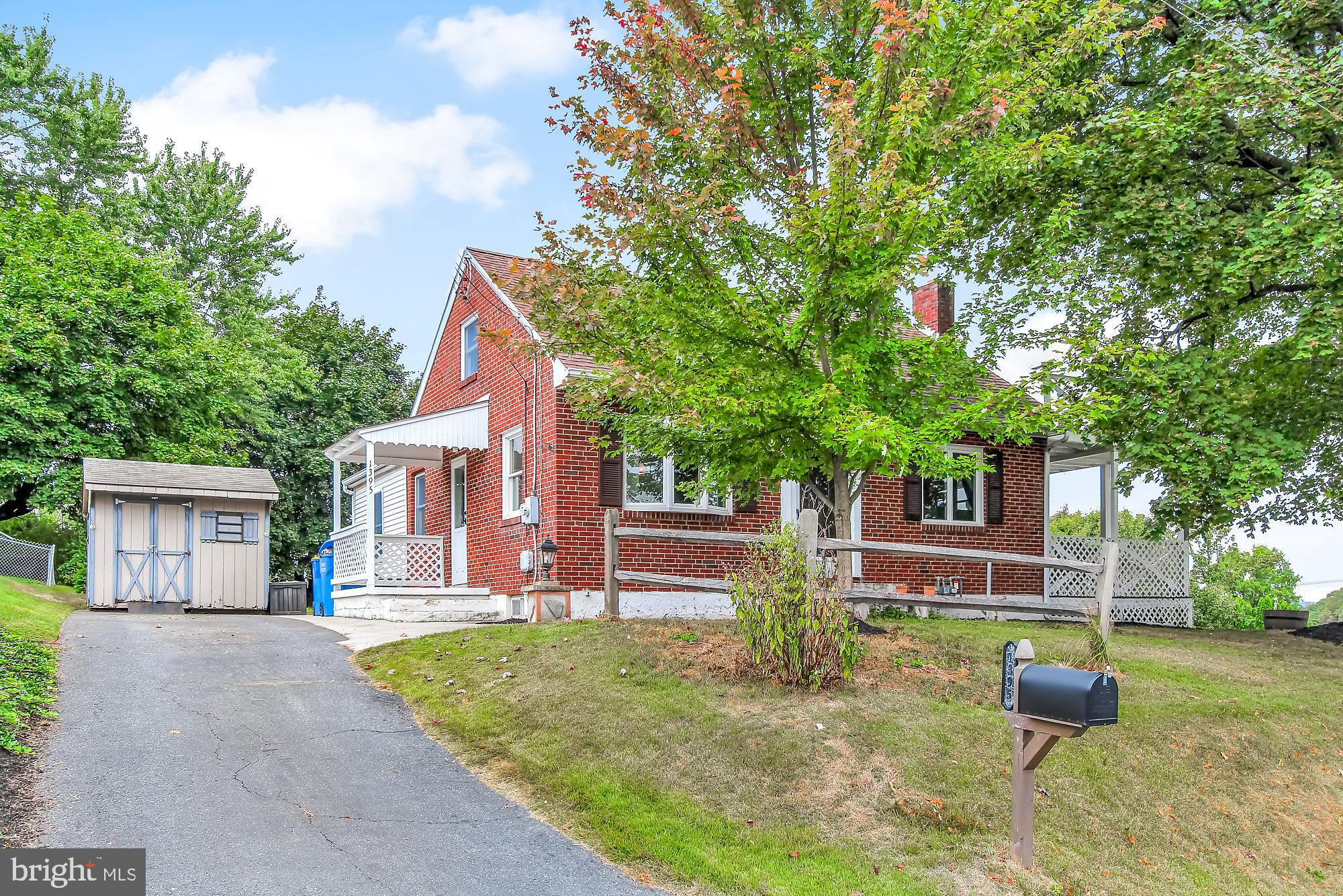 You must see this solid, brick Cape Cod with 3-4 Bedrooms on a desirable corner lot.   The galley kitchen has been completely redone with solid surface counters, beautiful tile backsplash, new cabinets, and newer appliances.  The formal Dining Room is spacious and has brand new flooring.  The bathroom recently received an update as well.  You will find the master bedroom and a nicely sized second bedroom on the main level.  The huge Great Room has a bar for all your entertaining needs and leads out to a patio and covered deck.  The entire attic has been converted to a bedroom with 2 closets and a private balcony with great views.  There is also a finished room in the basement which could serve as a potential 4th bedroom or the perfect man-cave.  And did I mention that Central Air has been installed and the new heating system has been converted to gas?  Also, there are 3 off street parking spaces for your convenience and a shed to store your outdoor gadgets.  So set up your private showing today!