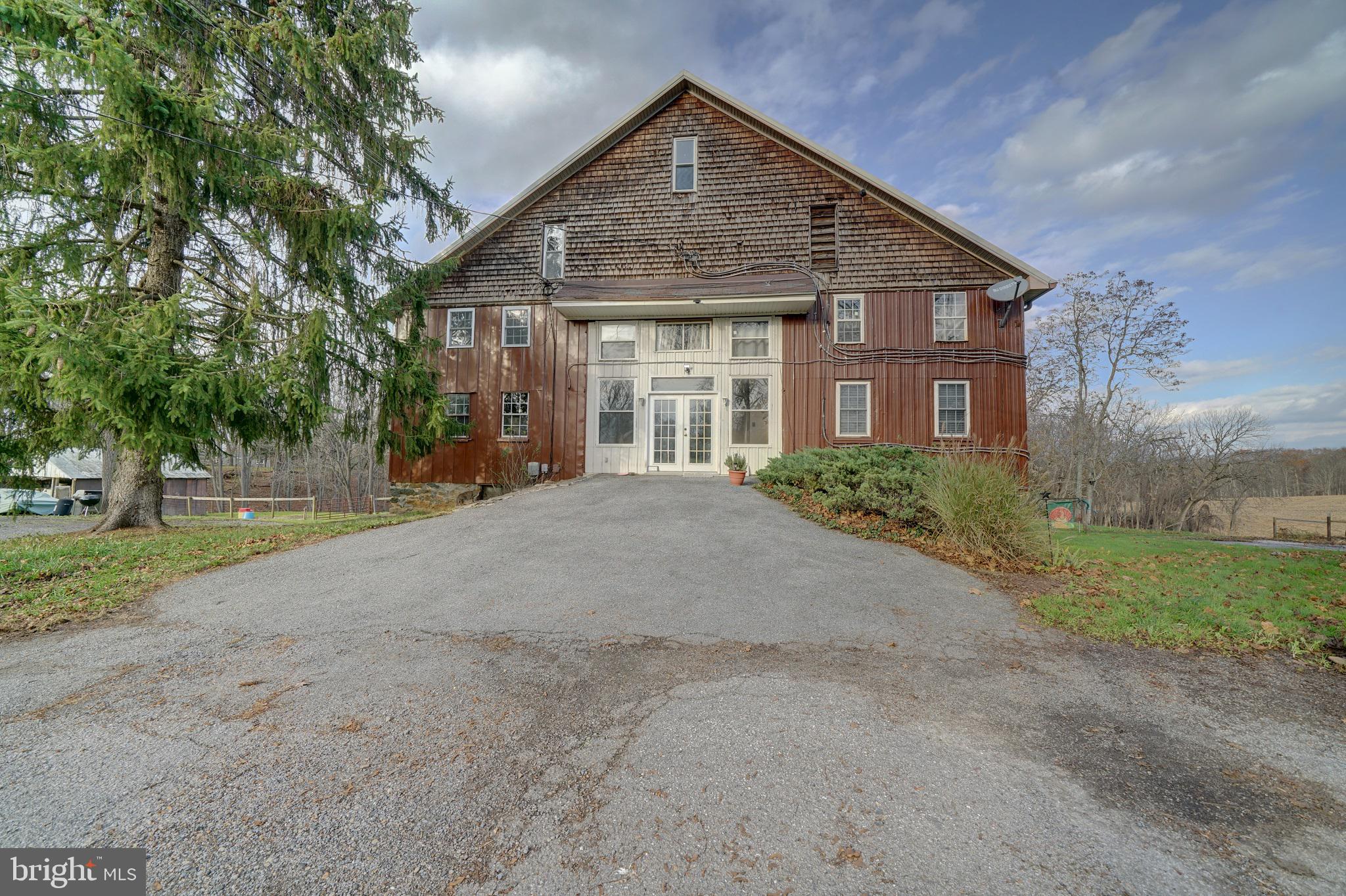 Unique apartment in Western Howard County, available immediately. 1 bedroom, 1 full bath. Fresh paint throughout, new range hood. Central HVAC system. Tenant only responsible for electricity - water is paid for by landlord. Located on a private farm with sweeping views of the country side, the apartment is located inside a large barn that has been converted into separate apartment units. Main entry to 'the barn' opens to open common area, with access to unit (located to the down the hall of the main door) and shared laundry facilities on the same floor. Inside the unit, walk into the great room with views of some of the 49 acre property. The great room features access to the private rear balcony. Kitchen complete with refrigerator, dishwasher and stove, sink and cabinetry and space for a table. Walk-in pantry or storage closet located in the kitchen. Off the great room is the primary bedroom with attached full bath, ceiling fan and walk-in closet. Open parking lot with 1 assigned parking space with views of the farm. Adjacent to the parking lot is open common area space with gazebo and picnic table with chairs. Property has been certified as lead free with the Maryland Department of the Environment and has a fire sprinkler system throughout. All grounds are maintained by landlord which includes lawn maintenance and snow removal on driveway.