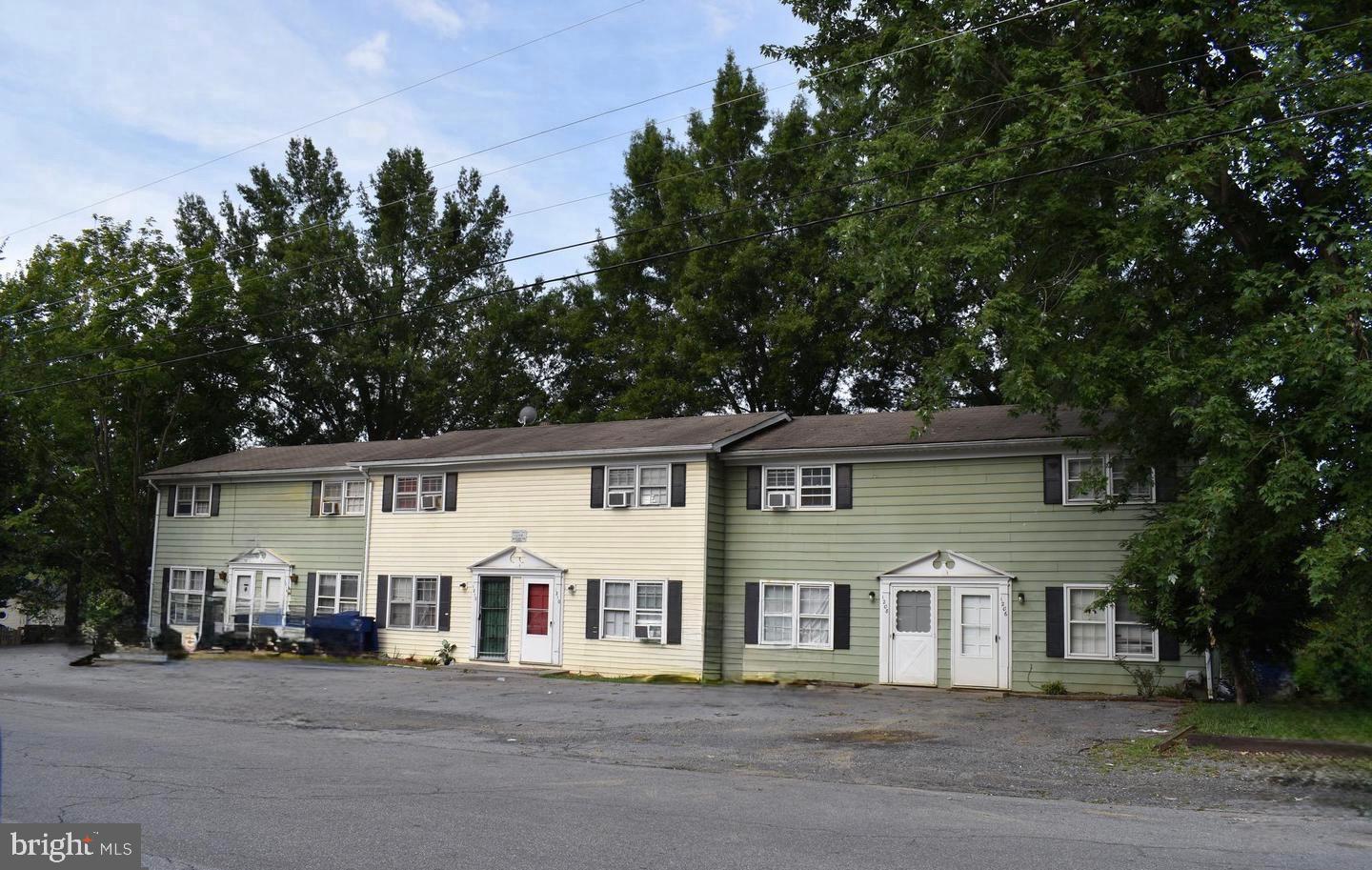 Rare opportunity to own a six-unit townhouse investment property in the heart of Front Royal! Featuring six 2-bedroom, 1-bathroom townhomes with front-door parking, this property is conveniently located near Downtown Front Royal, Main Street, I-66, Route 340, and the entrance to Skyline Drive.

The sale includes units located at 1206, 1208, 1210, 1212, 1214, and 1216, along with all five associated parcels in Royal Village (Lots 31–35). Current rents are approximately $1,100 per unit, offering strong income potential in a sought-after Shenandoah Valley location.

An excellent opportunity for investors seeking a multi-unit asset with long-term potential and convenient access to local amenities, commuter routes, and outdoor attractions. Property sold As-Is. Age of structure is approximate.