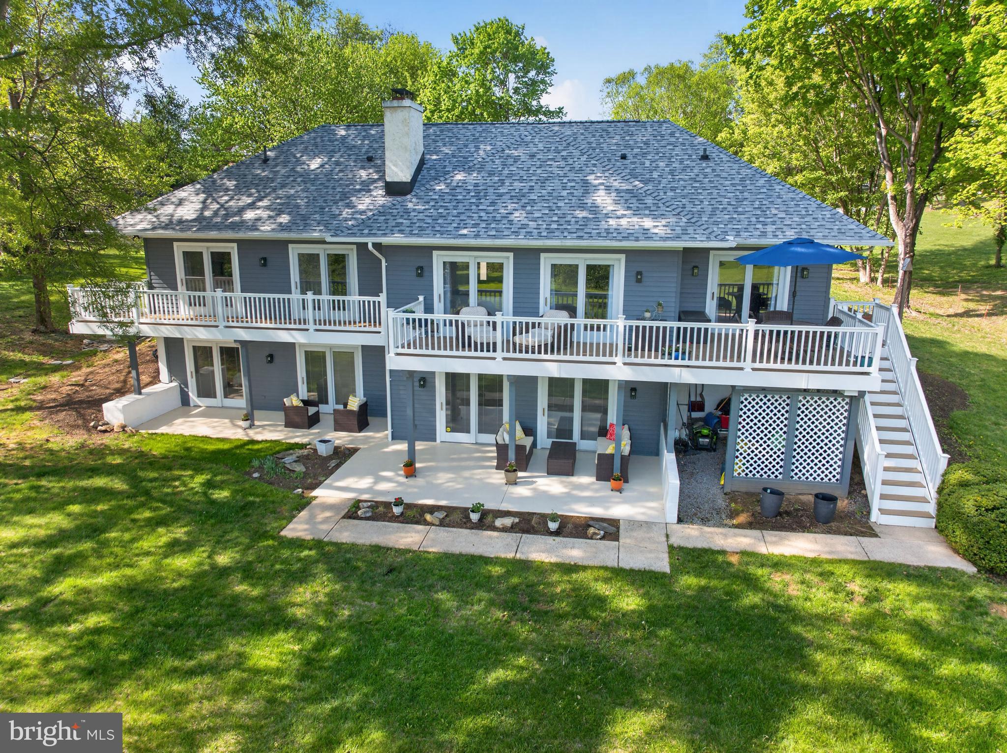 The striking combination hardiplank and cedar-sided ranch-style home sets beautifully in the well-appointed Cress Creek community, in one of the Best Small Historic Towns (USA Today 2026), offering a balance of modern-styling with classic architecture.  The exterior has been fully updated with a new roof (2024), new  hardiplank front and completely painted cedar siding (2025), and an updated rear deck (2025) and concrete patio that allow for privacy and relaxation in a huge backyard with distant golf course views.  The inside is adorned with oak hardwood floors, a large eat-in kitchen with quartz counter tops, a wood-burning fireplace on each floor, and a spacious entry-level primary bed and bath suite that enjoys on-level access to the home's best features.  Sliding glass doors stretch across the rear of the home allowing natural light and easy access to the outdoors from all the bedrooms and gathering areas on both floors.  The fully finished walkout basement offers additional living space and versatility with two flexible bedrooms that share a second full bathroom.  With an attached side-entry garage with added storage closets and golf cart parking and a community pool just steps away, this home is not just a residence; it’s a lifestyle. Experience the perfect blend of comfort, style, and convenience in this delightful property.