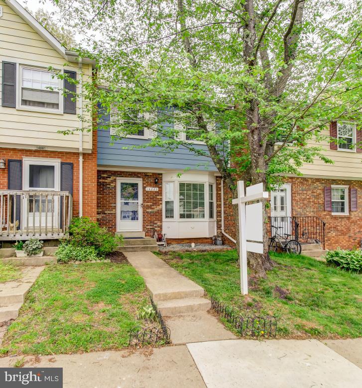 Nicely updated 3 bedroom townhouse that shows beautifully. Main level has wood floors. Kitchen has been updated with granite countertops and stainless steel appliances. Property backs to trees. Finished basement with walkout sliding door to fenced backyard with patio. Two assigned parking spots right in front. This house comes with a transferable home warranty.  Thanks for looking!