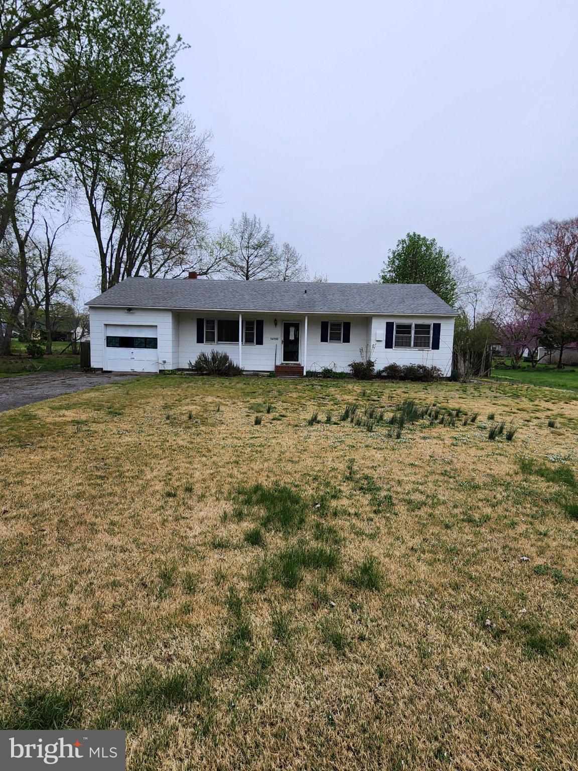 Discover the charm of Pittsville Manor with this inviting 3-bedroom, 2-bathroom ranch-style home, built in 1952 and nestled on a generous 0.57-acre lot. This detached residence offers a spacious layout with 1,368 sq. ft. of living space, perfect for comfortable living. The property features an attached garage with space for one vehicle, along with a driveway accommodating up to four additional cars. Enjoy the tranquility of the neighborhood while being just minutes away from local amenities, including parks, shopping, and dining options. Short drive to local beaches and state parks.  The condition provides a canvas for your personal touch, making it an ideal opportunity for those looking to create their dream space. With ample outdoor space and a welcoming atmosphere, this property is perfect for those seeking a peaceful retreat while remaining connected to the vibrant community. Experience the best of Pittsville Manor living today!