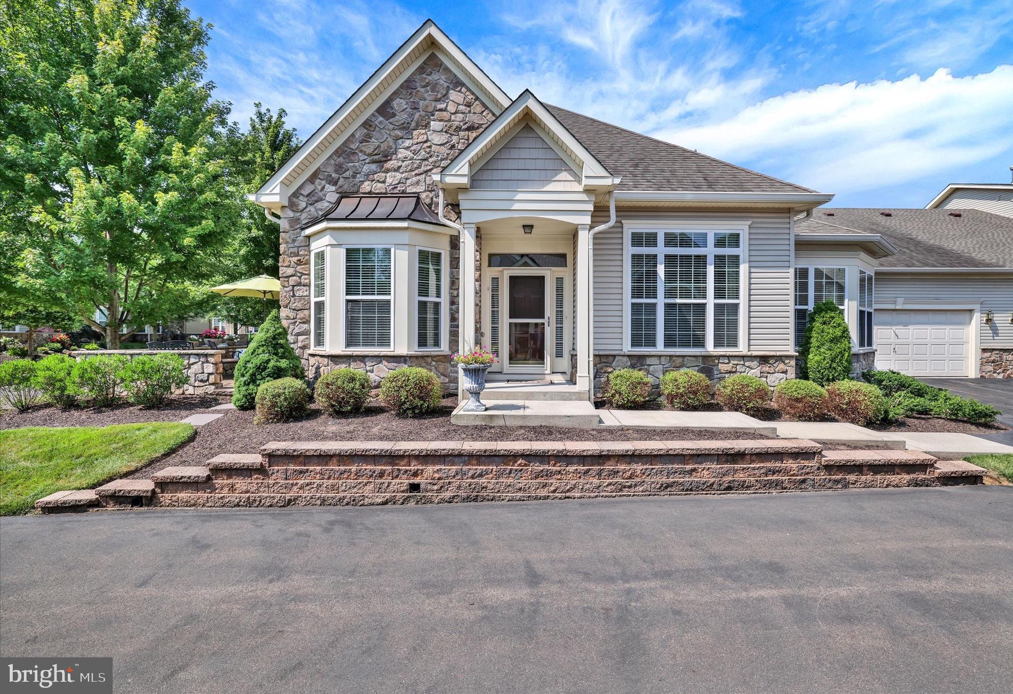 Welcome to The Villas of Newtown, the upscale  55+ community located in historic Bucks County. Enjoy maintenance free and luxury living in this beautiful move in ready Ashwood model. This  light filled open floor home is main level living at its best with the primary bedroom (2 walk-in closets with built-ins) and primary bath  are located on this level along with a second bedroom and full bath.  A foyer entry leads to a spacious living/dining area with high ceilings, hardwood flooring, crown molding and recessed lighting. The gourmet kitchen features a spacious eat-in area surrounding by a wall of windows, stainless steel appliances, 42” cabinetry, pantry, granite countertops, tile backsplash and a extended counter top. Opposite the dining room is the spacious gathering room with hardwood flooring, a gas fireplace with direct access to a brick patio with a stone privacy wall surrounded by beautiful landscaping. “A great place to relax”. The laundry/utility room, with sink, and additional cabinetry complete the main level living . A 3rd bedroom and full bath is located on the 2nd level for family and friends visiting along with a open loft and a spacious storage room. Last but not least is a two car oversized garage. Resort style and carefree living at its best featuring: a new state of the art clubhouse inclusive of a social room, exercise room, indoor pool, billiards room, card room, outdoor pool and a tennis/basketball/pickleball courts. Association dues include all clubhouse privileges, snow removal, lawn mowing, mulching, exterior painting . Conveniently located to all amenities and highways (1-95 and the PA turnpike) and the surrounding historic towns of Newtown, Yardley, New Hope and Doylestown. "Don't miss out on this magnificent move-in ready home.