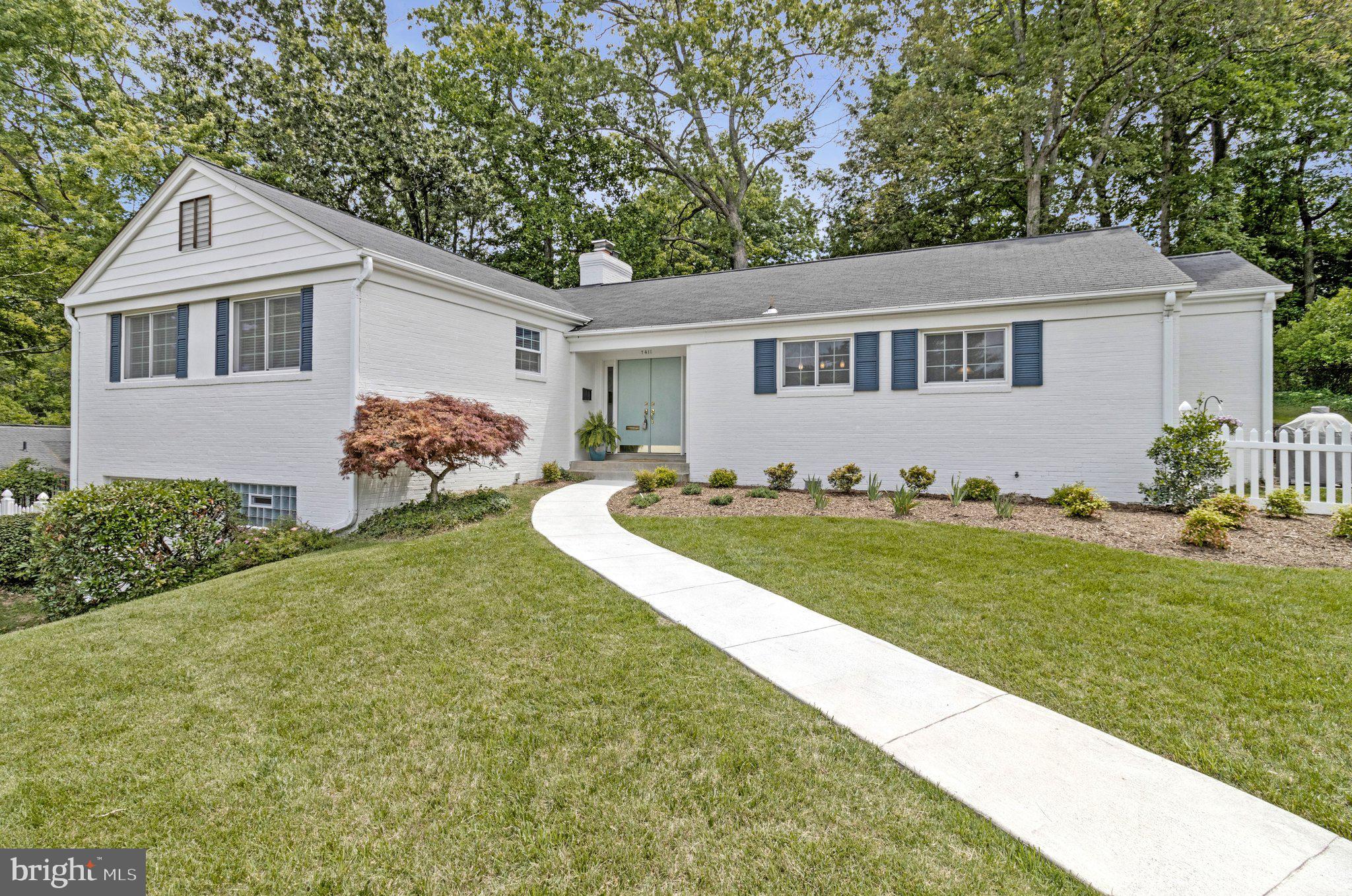 Welcome to 7411 Wyndale Ln, a charming single-family home located in the heart of Chevy Chase, MD. This beautifully crafted residence offers an inviting layout with 2,728 square feet of thoughtfully designed living space, featuring 3 spacious bedrooms and 2 well-appointed bathrooms, and attached garage!  Step inside to the front foyer and be greeted by the warmth of rich hardwood floors that flow throughout the main living areas.  The expansive formal living room features a gas fireplace and 3 large windows overlooking the back yard.  The formal dining room is fit for an oversized dining table, and leads to the showstopper sun room with natural light pouring in from the floor to ceiling windows!  The spacious kitchen includes space for a breakfast nook, plenty of cabinet and granite counter space, and newer stainless steel appliances, overlooking the incredible front lawn!  Just two small steps lead to the bedroom level with 3 large bedrooms, including a huge primary suite with attached primary bath.  A renovated hall full bath and two closets round out bedroom wing of the house.  The finished basement includes a newly painted recreation/family room with built-in shelves, a large unfinished space with full size washer/dryer, hvac/utilities, extra storage, hidden extra half bathroom and entrance to the garage with space for a vehicle and even more storage.  Move in with ease, as many of the major items have already been recently replaced:  New HVAC/Furnace 2024, New Roof 2018, New Windows 2018-2022, Hot Water Heater 2017, New Gas Range 2025, New Refrigerator 2024, New Dishwasher 2020.  Outside the sun room, you can enjoy a newly landscaped patio (2024) and large fenced in yard (Fence 2025).  Sitting on a 12,000+ square foot lot, this home is ideally located just minutes to public transportation, Metro, Rock Creek Park, Candy Cane City Park, shopping, dining, and easy commute into DC!