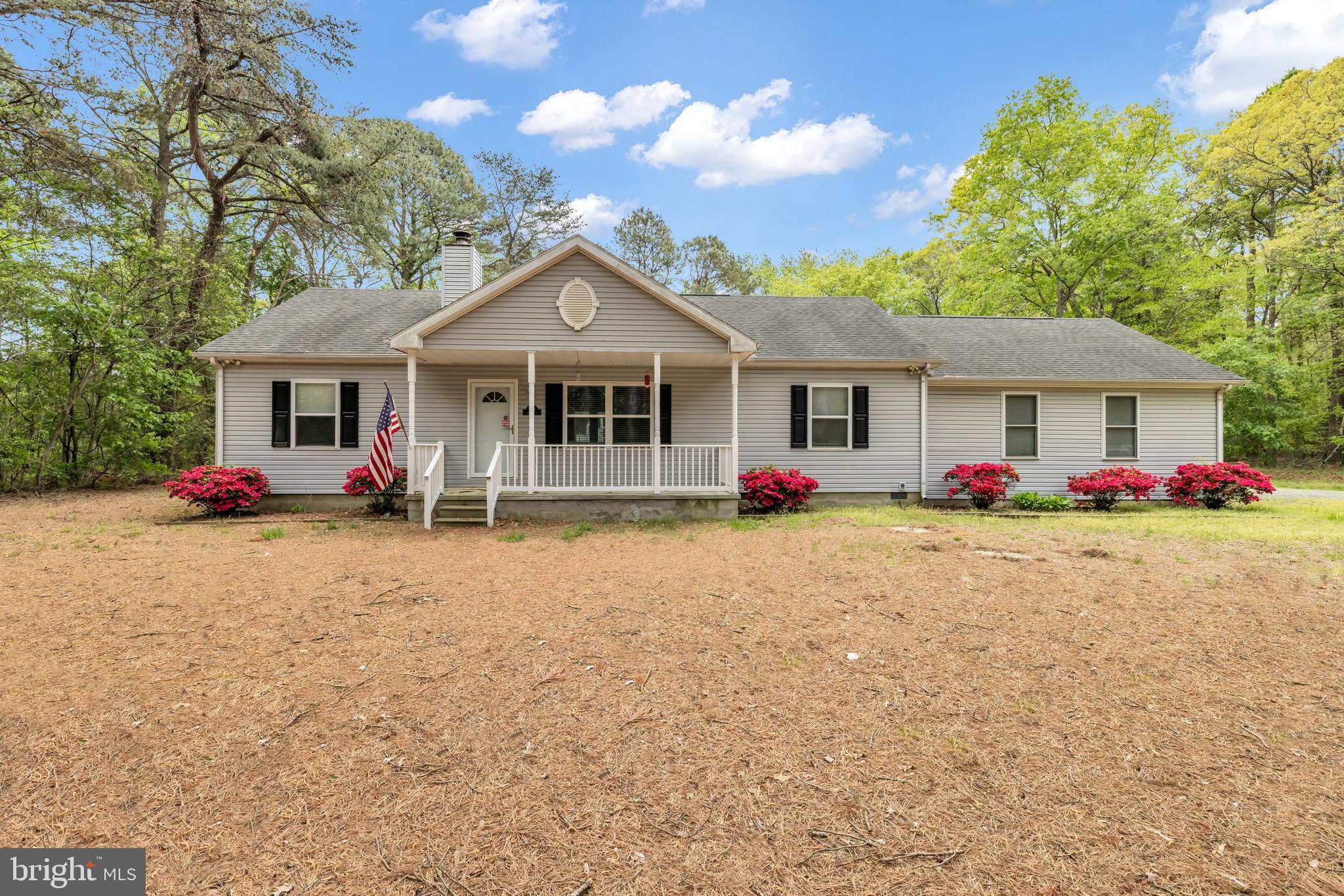 This very comfortable rancher with a large high-quality above-ground pool with direct access to sunroom and into the home without getting feet dirty (yeah)!  Roomy kitchen and open floor plan allows large gatherings to enjoy the roominess.  Working wood-burning fireplace is great for use to heat home all winter or just on-call use when you want the ambiance.  Convenient mudroom off garage with washer and dryer; going on into the kitchen with the pantry next to mudroom for convenience.  Large counter seats 4 comfortably.  Dining area for full-size table and chairs.  Large (24' deep x 23' wide) two-car garage with overhead door and remote controls and shelving for storage.  Full-size attic with flooring providing lots of storage area.  Two large outback sheds (insulated and electric) for many uses including a craft shop, carving shop, etc.; one is complete with a pellet stove for cool/cold days or evenings.  All of this and more comes with privacy and deeded walking rights to the dock/pier at the end of the lane.  Perfect to just relax and enjoy the water or to crab/fish.  All this comes with 3.23 private acres of "home" written all over.  Schedule your appointment today!