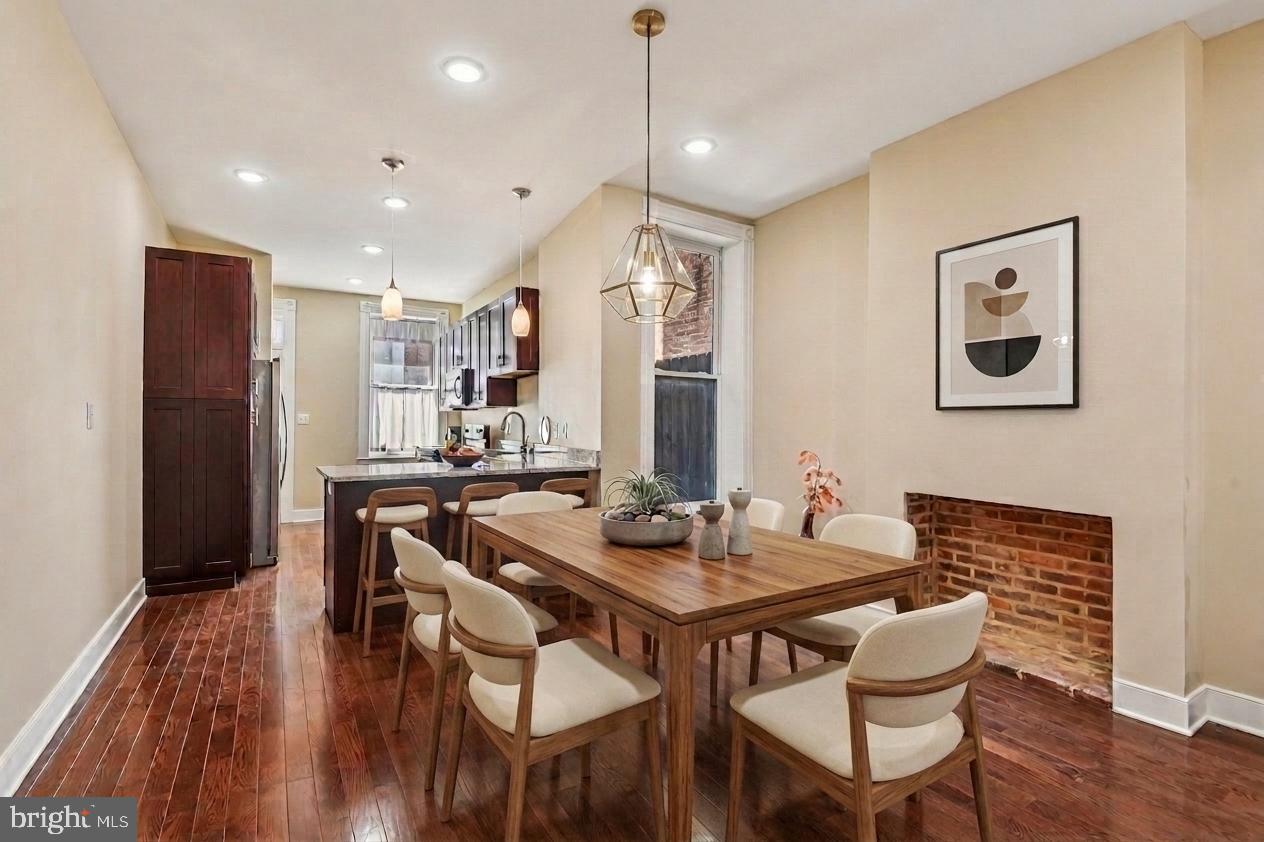 Price Improvement!  Thoughtfully upgraded, this stunning brick-front townhouse offers the perfect blend of historic charm and modern comfort in Baltimore’s vibrant Oliver neighborhood. A home warranty is included for added peace of mind.
Featuring 2 bedrooms and 2.5 baths, the home showcases classic Baltimore character with iconic marble steps, decorative brick fireplaces, and intricate architectural details throughout. Inside, gleaming hardwood floors, recessed lighting, and a striking half-circle arched hallway create a warm yet refined atmosphere. The open staircase overlooks a formal dining area that flows seamlessly into a fully equipped kitchen complete with Whirlpool stainless steel appliances, tall soft-close cabinetry, sleek countertops, a breakfast bar with pendant lighting, and a built-in wine rack.
Upstairs, the spacious primary suite offers a spa-inspired bath and walk-in closet, while the second bedroom provides generous space for other occupants,guests or a home office. A conveniently located upper-level laundry closet adds everyday ease and convenience.
Step outside to enjoy a private, low-maintenance fenced backyard—ideal for relaxing or entertaining. Additional highlights include a full unfinished basement and the comfort of a brand new central HVAC system with a new water tank and expansion tank.
Perfectly positioned for convenience and lifestyle, the home is just a short walk to Oliver Recreation Center, a quick 3–5 minute drive to Johns Hopkins Hospital, and only minutes from National Great Blacks In Wax Museum. This location offers both neighborhood charm and access to some of Baltimore’s most important destinations.
Situated within a strong and supportive community with an active neighborhood association, 1602 N Bond Street offers more than just a home—it offers connection, convenience, and long-term value.  Wait there's more! This Home is eligible for Vacant to Values, Live Near Your Work and several other First Time Home Owner Programs.
Don’t miss the opportunity to make this exceptional townhouse your own!

AI was used to assist with media generation