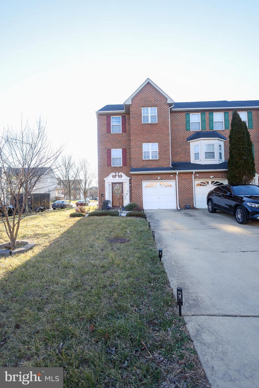 Welcome home to this beautifully maintained brick-front end-unit townhome ideally located in the heart of Clinton. Offering generous living space, thoughtful upgrades, and excellent indoor-outdoor flow, this home checks every box.
The entry level features a finished lower-level recreation room with a cozy fireplace, a convenient powder room, and direct walk-out access to a paved patio, making it perfect for entertaining or relaxing. The one-car garage is complemented by an exceptionally long private driveway, providing ample parking.
The main level boasts a spacious formal dining room, a large living/family room that opens to the deck, and an additional powder room for guests. At the heart of the home is the eat-in kitchen, complete with a center island, upgraded stainless-steel appliances, stone countertops, and an abundance of cabinetry for storage—ideal for both everyday living and hosting.
Upstairs, retreat to the expansive primary suite, featuring vaulted ceilings, a bump-out for added space, a walk-in closet, and a private en-suite bath. Two additional well-sized bedrooms and a full hall bath complete the upper level.
Additional highlights include a nice sun deck, fenced-in yard, newer roof, and updated systems throughout, reflecting true pride of ownership.
Conveniently located with quick access to AAFB, shopping, dining, public parks, the local library, post office, park-and-ride options and MGM/National Harbor, this home also offers easy commuting routes throughout Prince George’s County and into Washington, DC. A fantastic opportunity to own a move-in-ready home in an established and well-connected community