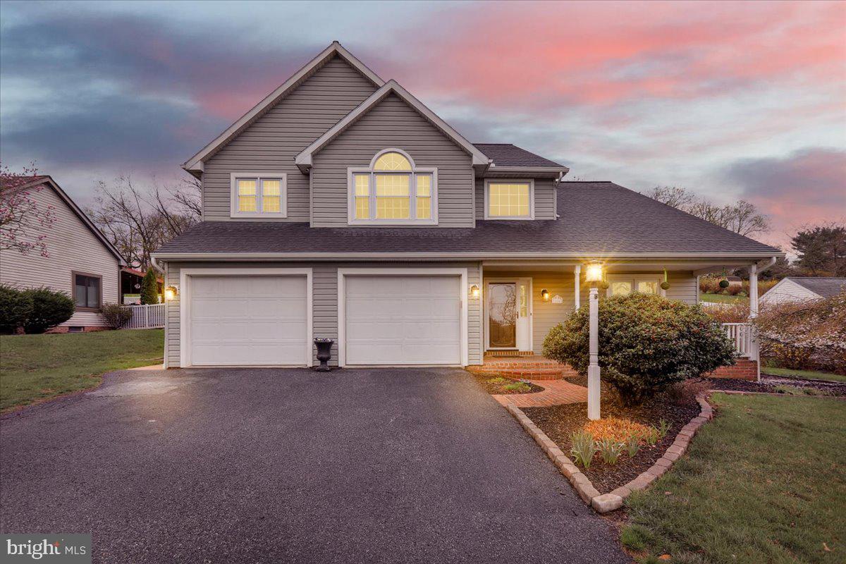 Nestled on over half an acre, this fabulous home offers the perfect blend of comfort and entertainment. Step inside to discover an open floor plan adorned with gleaming hardwood floors, creating a seamless flow throughout the main living areas.  The spacious dining room is ideal for hosting memorable dinners, while the kitchen, open to the family room, boasts modern amenities and a cozy gas fireplace, making it the heart of the home. Convenience is key with a first-floor laundry room, ensuring everyday tasks are a breeze. Retreat to the primary bedroom, featuring cathedral ceiling, hardwood floors, a generous walk-in closet, and a spacious primary bathroom.  Crafting room or office den space on the upper level is perfect for all of your creative ideas. The finished lower level is an entertainer's paradise, complete with a bar and a charming reading nook. Outside, the covered patio and inviting in-ground pool provide the ultimate setting for outdoor gatherings and relaxation. This home is truly an entertainer's dream, offering ample space for both intimate and larger gatherings.