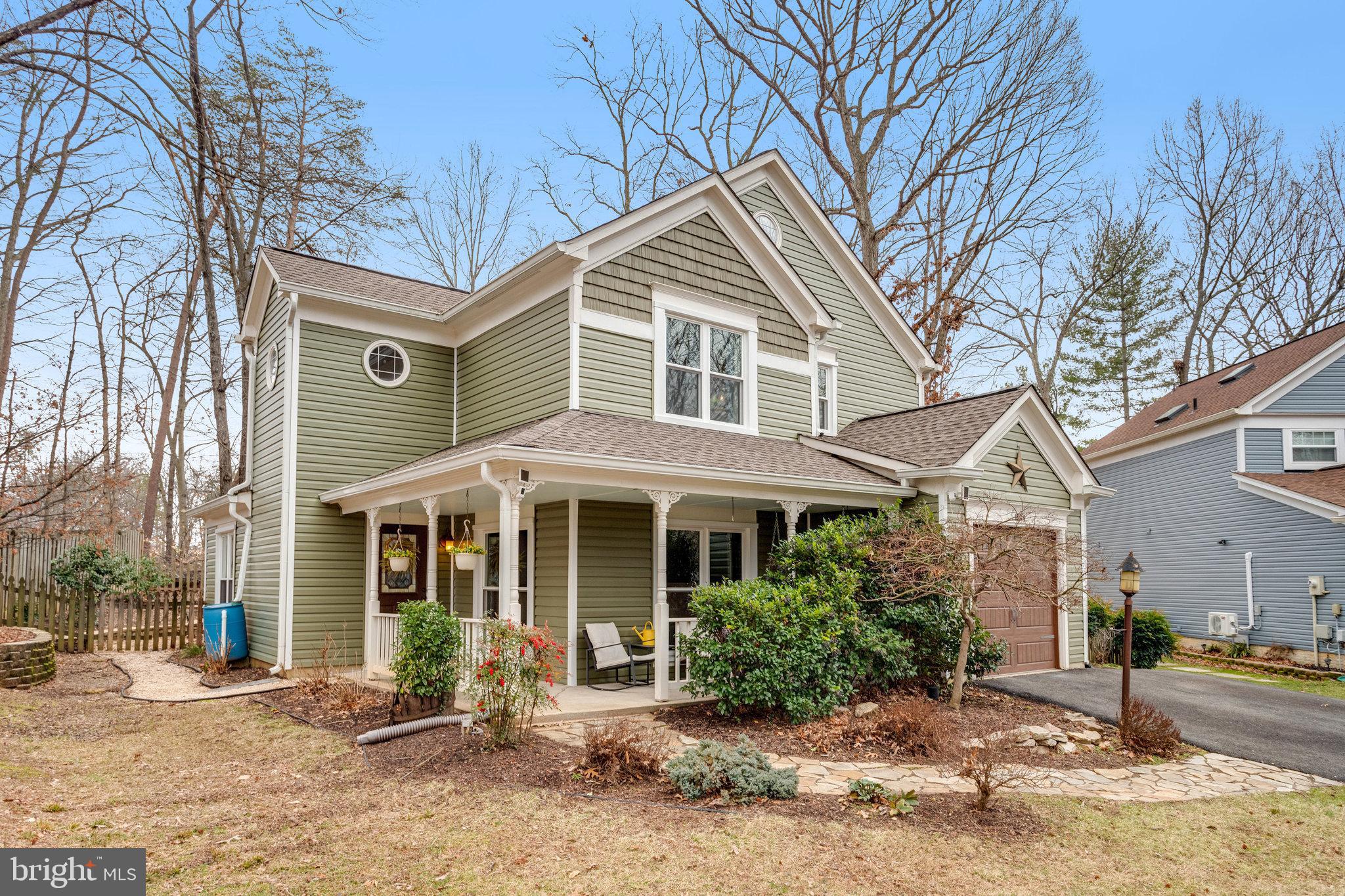 Welcome to 15251 Larkspur Lane! 
**Offer Deadline is 12:00 noon on Monday, February 5, 2024.  **This Well Appointed Bungalow has Functional Updates and Beautiful Upgrades Throughout *  Spacious Wrap Around Front Porch has Room for Seating and Porch Swing, the Perfect Place to Relax on Warm Summer Nights * Enjoy the Privacy on this Wooded Lot Situated at the End of a Pipestem * Enter this Home to an Inviting Two Story Foyer with Ceiling Fan and Lovely Stained Glass Door * Two Fully Finished Levels Contain 3 Bedrooms and 2.5 Baths with almost 2,000 Square Feet of Living Space * Stunning Open Concept Kitchen Boasts Quartz Countertops, Stainless Steel Appliances, Tiled Backsplash, and Stylish Lighting Fixtures * Wide Plank Hardwood Floors Throughout Both Levels Creates a Seamless and Elegant Effect * The Warm Wood also Creates a Warm and Inviting Environment * Light Filled Eat In Kitchen Has a Cozy Sitting Area with Wood Burning Fireplace and Mantel *Backyard has Lovely Hardscaping with Expansive Stone Paver Patio and Retaining Wall - Excellent for Relaxing and Entertaining * Shed and Firepit Convey with the Home* Large Family Room has Eye Catching Wood Accent and Board and Batten Walls * Powder Room and Laundry Conveniently Located on Main Level * One Car Attached Garage has Extra Storage Area and Garage Door Opener * Stairs to the Upper Level Have Hardwood and Plush Carpet Runner* Spacious Primary Bedroom has Walk in Closet and Unique Window Overlooking Foyer * Primary Bathroom has Dual Sinks, Glass Shower, and Private Water Closet * Two Secondary Bedrooms Have Large Closets and Hardwood Floors* Hall Bath has Tile Floor and Tub Shower * Siding is Brand New, Replaced December 2023 * Windows On Whole House were Replaced In 2021 * This Stunning Home is Located in the Beautiful, Sought After Montclair Community * Three Private Beaches in Community, as well as Playgrounds and Paths * You Won’t Want to Miss Your Chance to View and Own this Spectacular Property!*