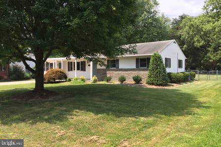 Beautiful, four bedroom, ranch-style home on level lot with spacious, fenced backyard perfect for children and one small dog.  Kitchen has newer cabinets, stainless steel appliances and granite counters. Hardwood floors. Updated bathrooms. Energy efficiency improvements include a fully encapsulated, insulated crawlspace and R49 attic insulation.  Quiet street.