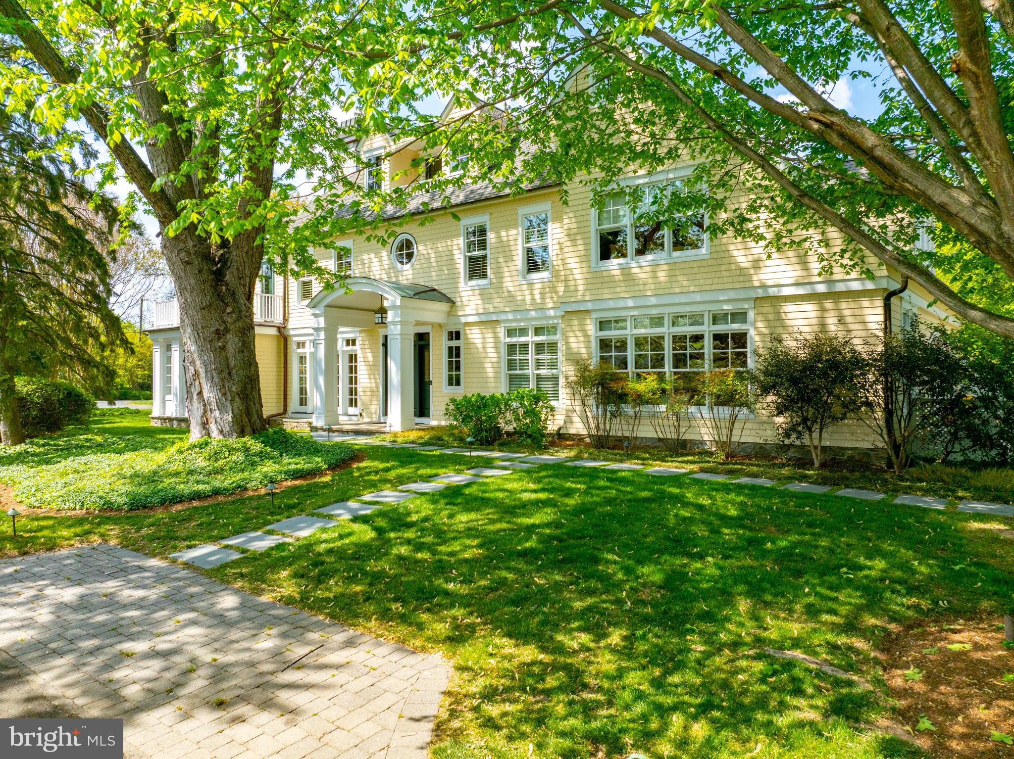 A coveted residence, beautiful grounds and lap pool located in Pendennis Mount offers a unique opportunity for any Buyer seeking a signature, spacious, elegant, shingle style home. This well maintained 5 Bedroom, 4 full, 2 half bath home was designed by Boggs and Partners Architects and built by Lundberg Builders in 2002. Boasting over 6500 sq. feet of living space, the interior is warm, well-proportioned, and beautifully detailed, easily accommodating large interior gatherings. Three sets of French Doors from the screened porch, dining room, and kitchen open the home to exquisite and magical exterior spaces. This private oasis within a wonderful neighborhood includes a large ipe veranda featuring a custom height pergola and stone planter, a bluestone patio, and intimate circular fire pit space, all perfect for entertaining. Bluestone paths lead to a lap pool (with fountains), hot tub, and a gathering spot between a pair of matching pool house structures. This space includes a fireplace and outdoor shower. Established specimen plantings and trees.
The home offers four finished levels of living space. An upper floor, featuring a pool table, bar, balcony and half bath, provides great space for watching sports or enjoying a “tree house” feel. The bedroom level includes a spacious primary suite with office, walk in closet, gas fireplace, and private bath, as well as three additional bedrooms, two full baths, laundry room and ample linen storage. The main level features wide plank mahogany floors, extensive millwork and built-in storage, coffered ceilings, and two fireplaces. This floor includes a bedroom suite, spacious living and family rooms, a gracious dining room, screened porch, custom eat-in kitchen, pantry, and mudroom. The lower level includes an exercise room, and recreation/TV space. Oversized, attached, two car garage. Fabulous location within Annapolis, minutes to downtown across the Naval Academy Bridge, dining, shopping, biking the B & A trail and easy access to Route 50.